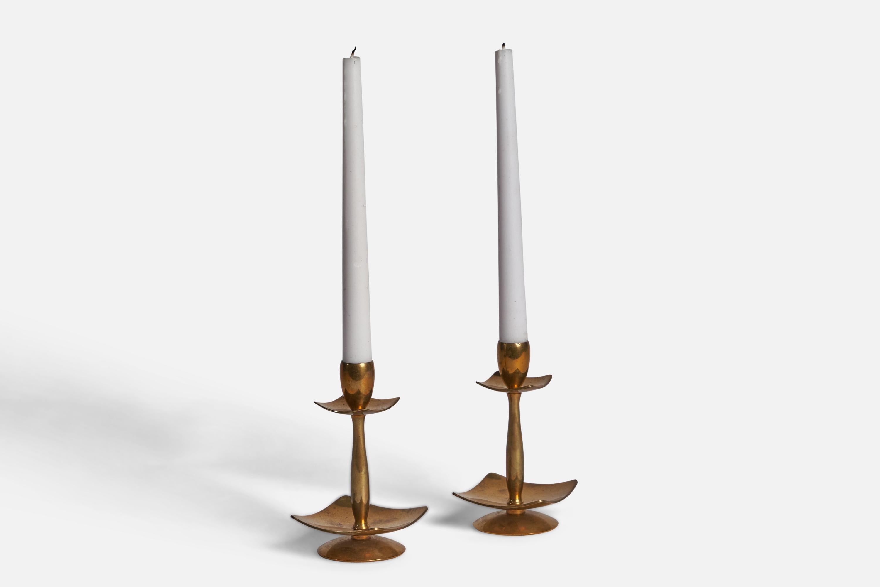 A pair of brass candlesticks designed and produced by Dantorp Design, Denmark, c. 1950s.

Fits 0.45” & 0.80” diameter candles