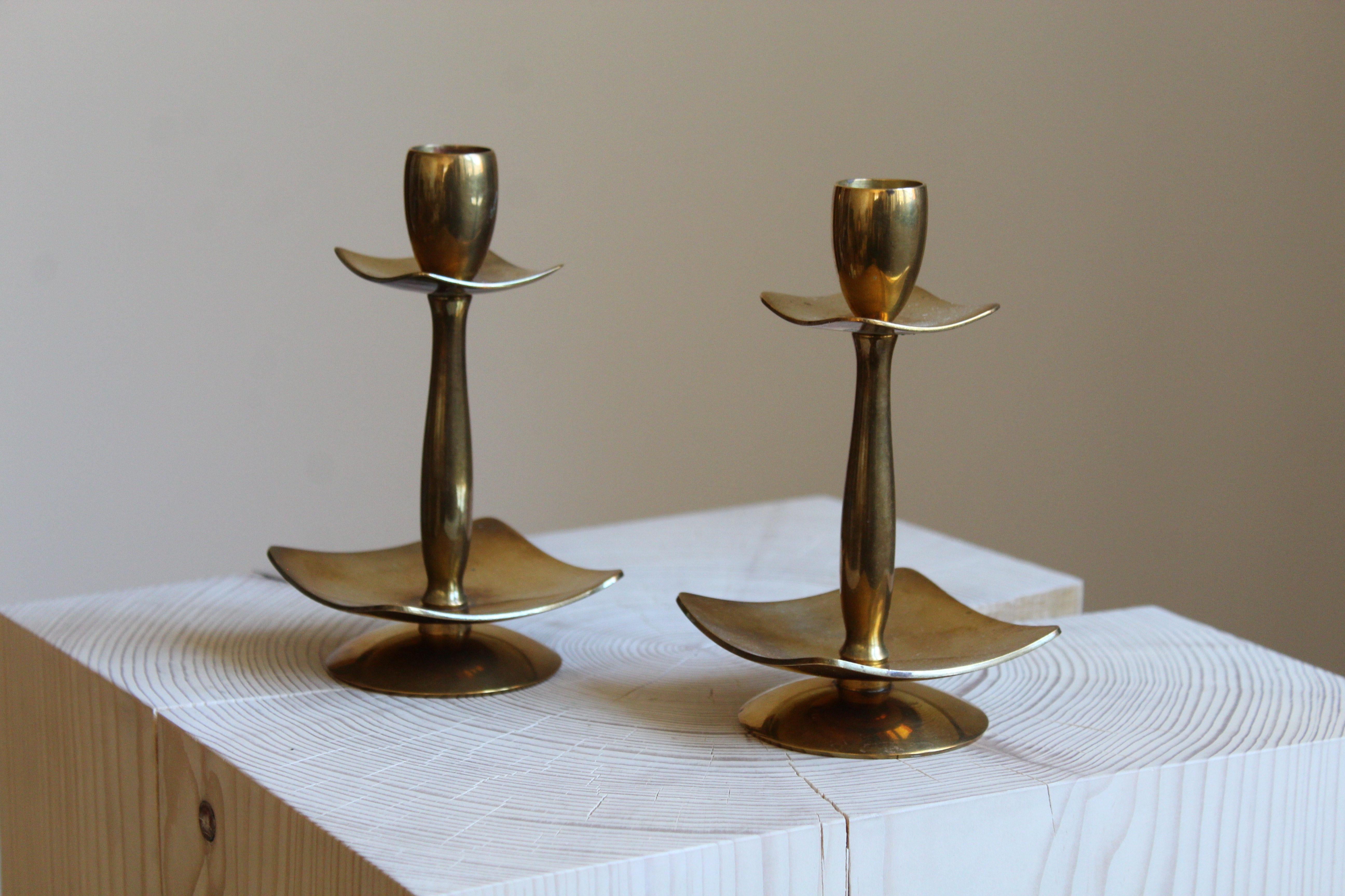A pair of modernist candlesticks. Designed and produced by Dantorp, Denmark, 1960s. In brass, stamped.