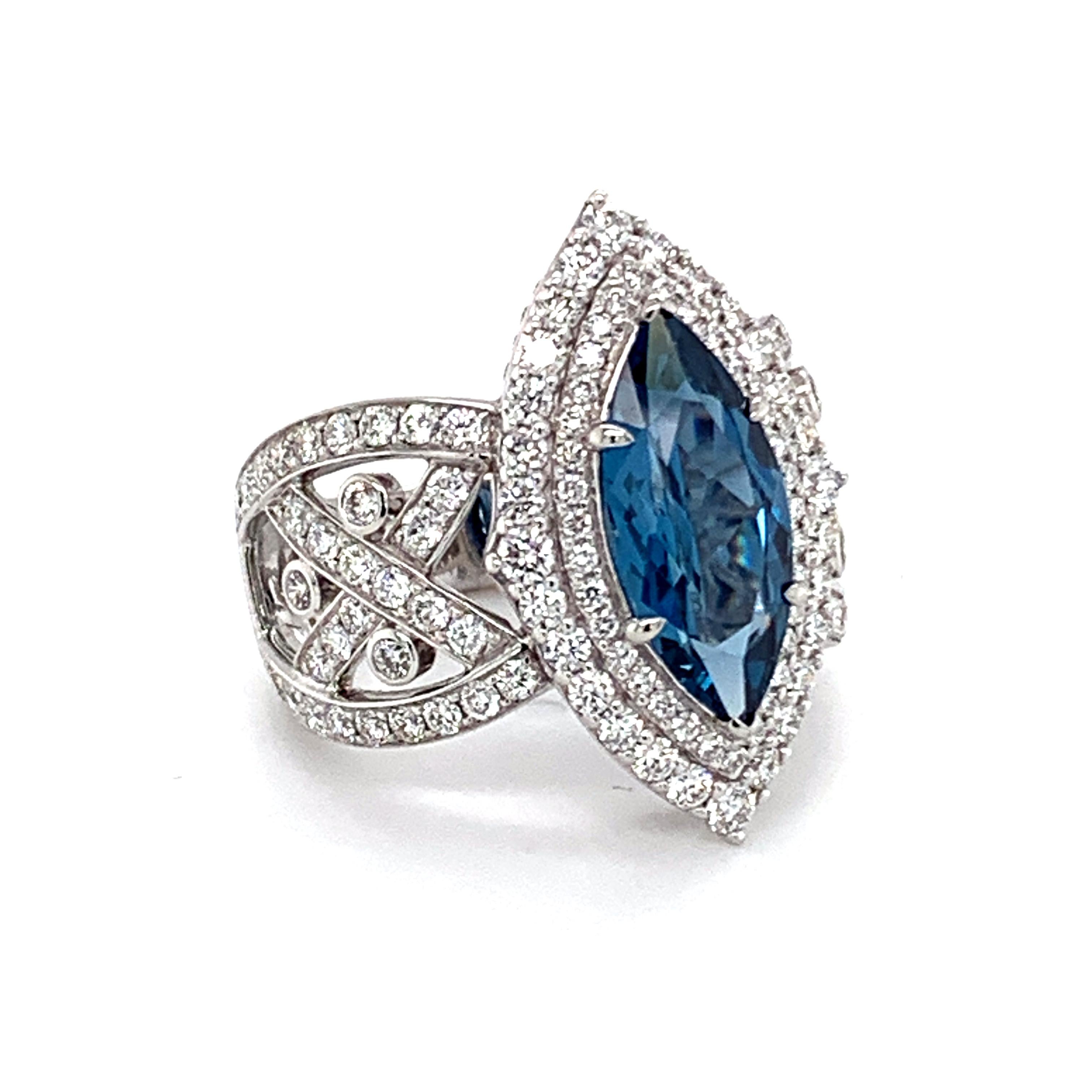 Stunning one of the kind ring in solid platinum  designed by Danuta set with center marque shaped intense color Blue Zircon and 1.82 carat pave diamonds FG color VS clarity. 