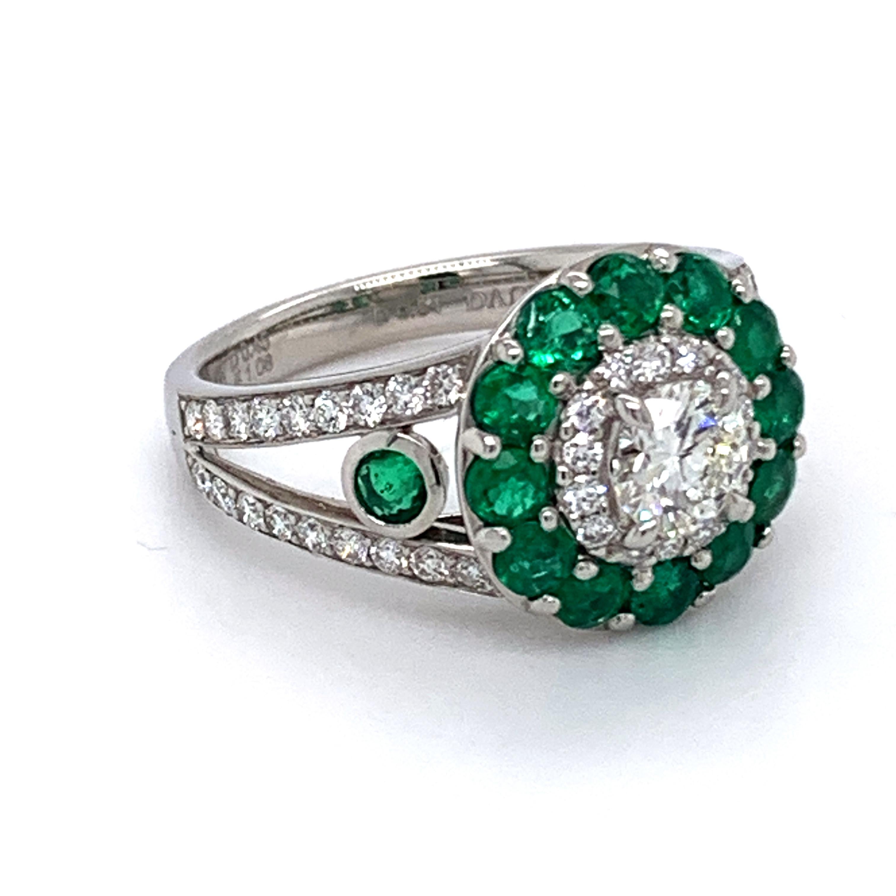 Solid Platinum ring one of the kind designed by Danuta set with diamond center .54 carat total weight G color VS1 clarity surrounded by 
emeralds of 1.08 carat and pave diamonds .45 carats total weight