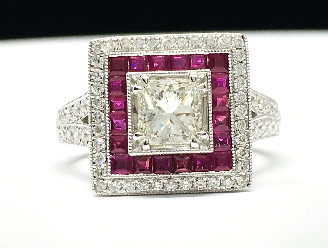 METAL : White Gold
METAL PURITY : 18k
PRINCESS CUT CENTER DIAMOND : 0.86 TCW 
COLOR: H-I
CLARITY : VS2
24 ROUND DIAMONDS : 0.55 TCW G-VS2
20 RUBY: 0.52 TCW
SIZE: 7
Comes with Authenticity Papers.