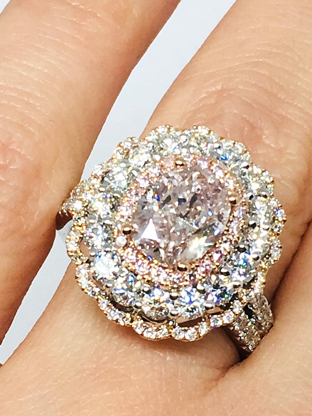 We introduce you another piece of art with this astonishing GIA CERTIFIED FANCY BROWNISH PINK DIAMOND , with a triple halo of pink and white diamonds .
METAL: White Gold , Rose Gold
METAL PURITY: 18k
Center Diamond : GIA PINK DIAMOND 1.87 TCW 
Pink