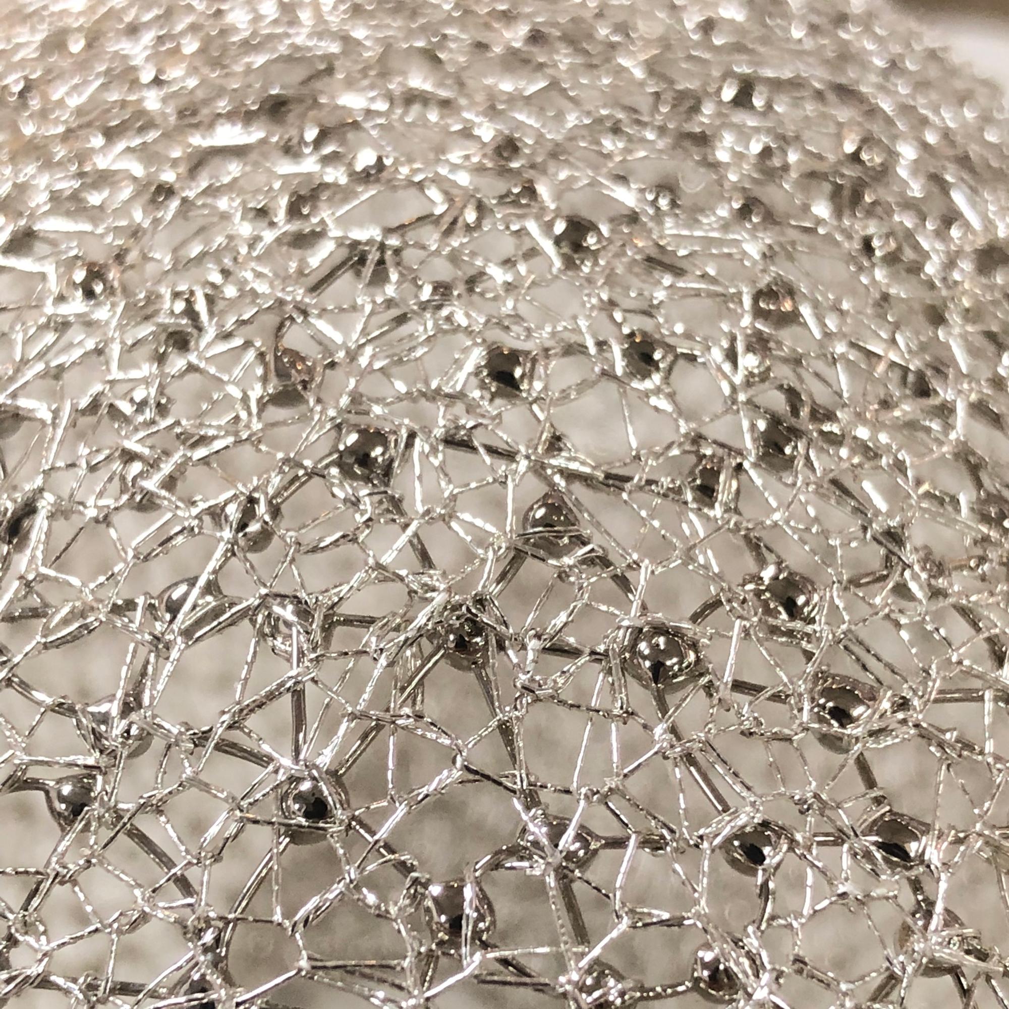 The Dapple Ceiling 8 by Ango is an installation piece that transforms any space with its unique design and artistic fabrication. Utilizing the traditional Thai handcrafted technique of 