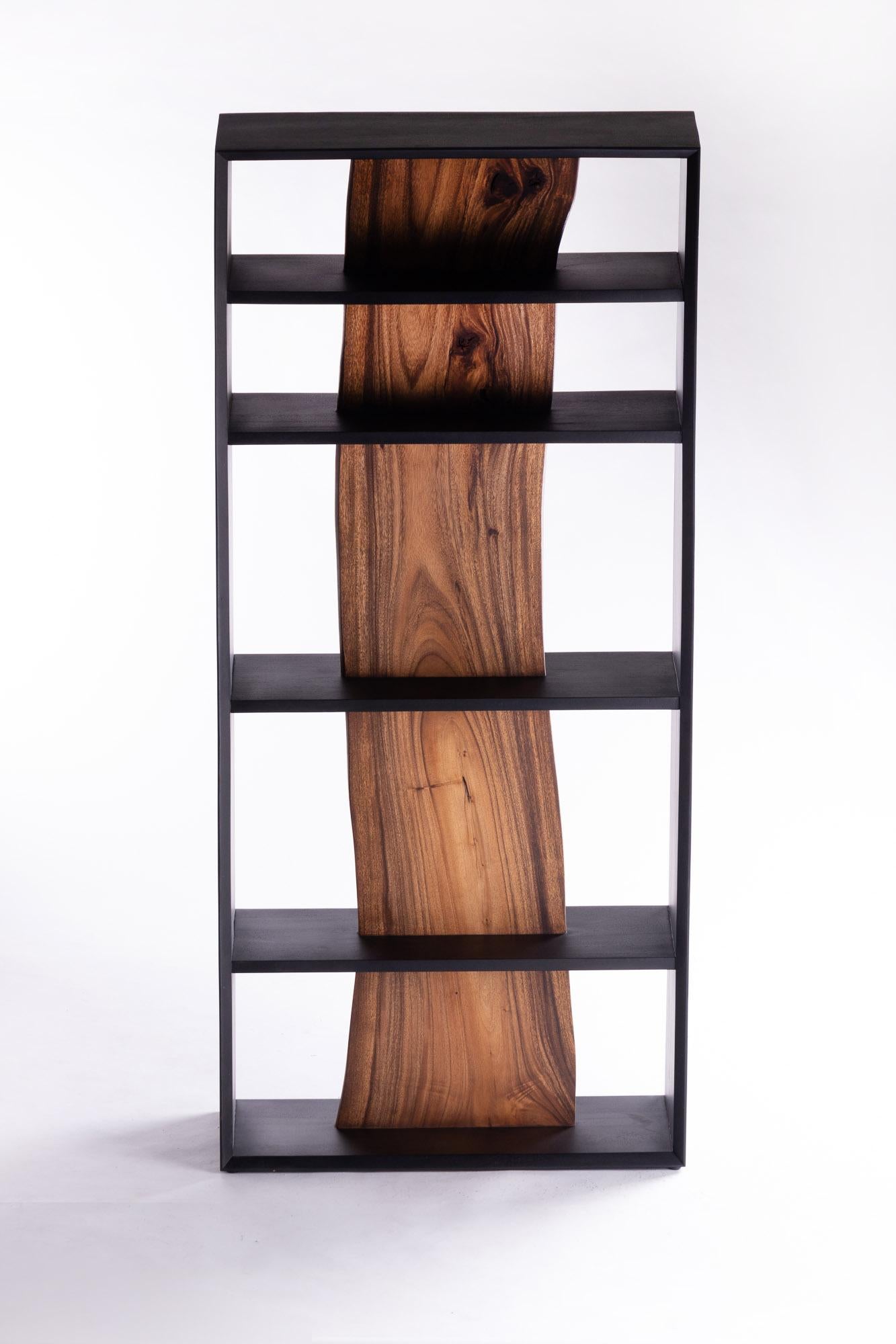 A great deal of time was spent considering the best way to cut wood without wasting its unique beauty. After careful consideration, this wood piece maintains its essential values by combining natural-shaped wood with simple pieces, creating a shelf