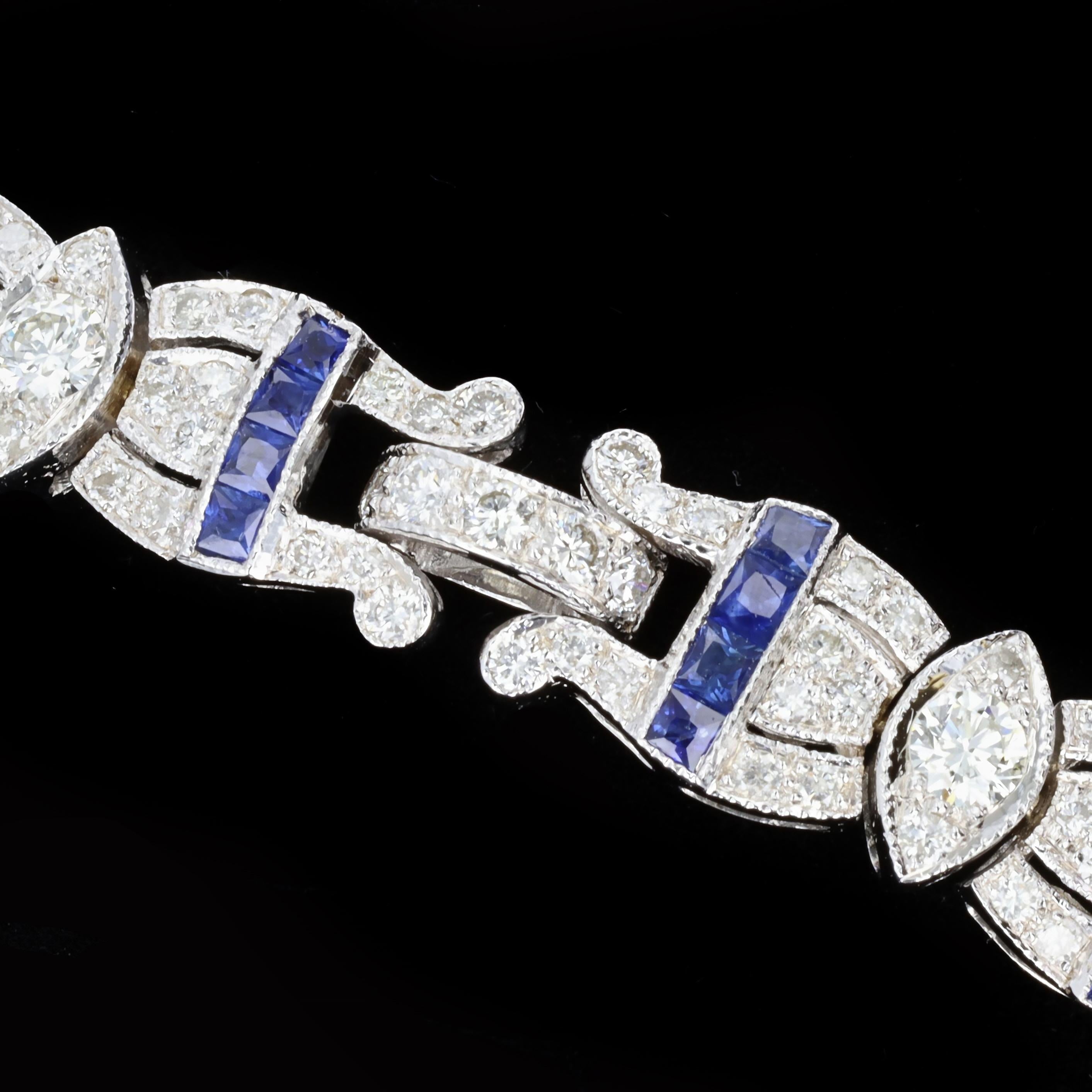 A brilliant diamond and sapphire bracelet that will sparkle as bright as you do. This 18K white gold bracelet is set with round cut diamonds weighing approximately 3.67ct. and is accented by 56 lovely square cut sapphires. The color of these