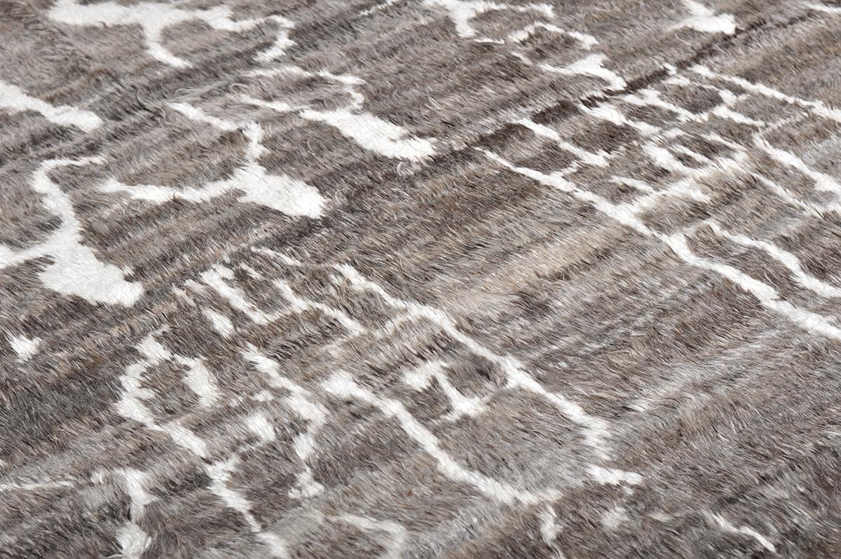 Designed in LA 'Darell' is a handwoven contemporary interpretation of an Azilal tribal rugs from Morocco. They are noted for their hand-spun wool, saturated color, intuitive motifs and charmingly irregular surface. Created with perfect earth tones
