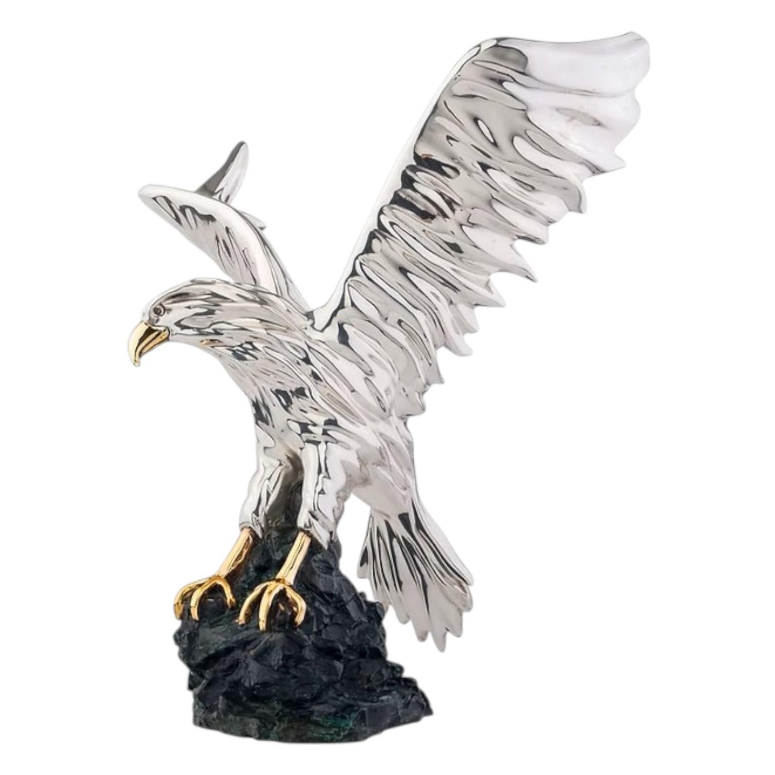 This stunning D’Argenta eagle sculpture from Mexico embodies the brand’s renowned artistry and craftsmanship. Measuring 11.75 inches tall, the majestic eagle is captured mid-descent, wings outstretched in a commanding pose that symbolizes power,