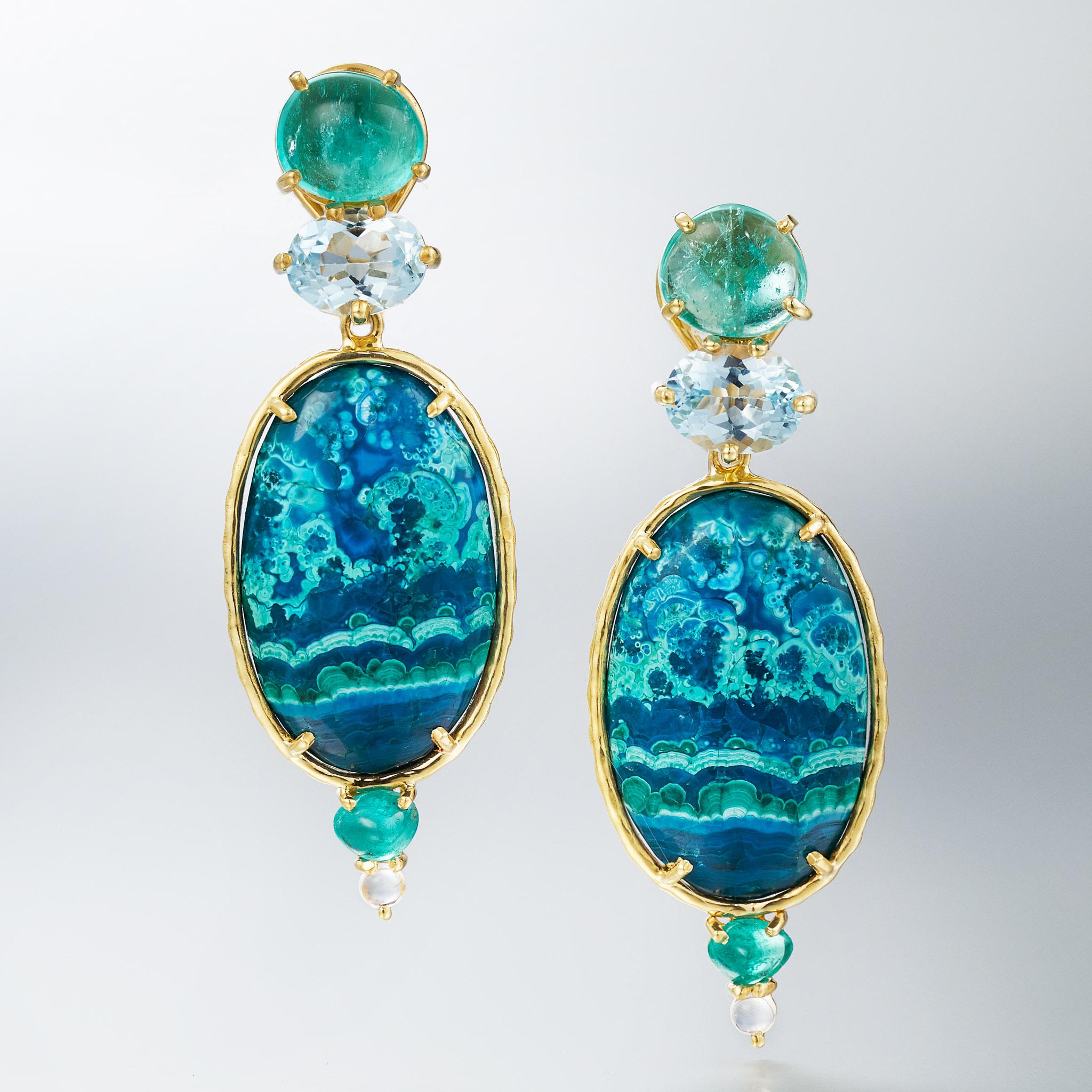 In collaboration with Muzo, the famed emerald mines in Colombia, these earrings feature freeform jelly emeralds, faceted blue topaz, stunning chrysocolla-in-malachite, with trillion-shaped emerald and aquamarine cabochons. Over 7 carats of emerald.