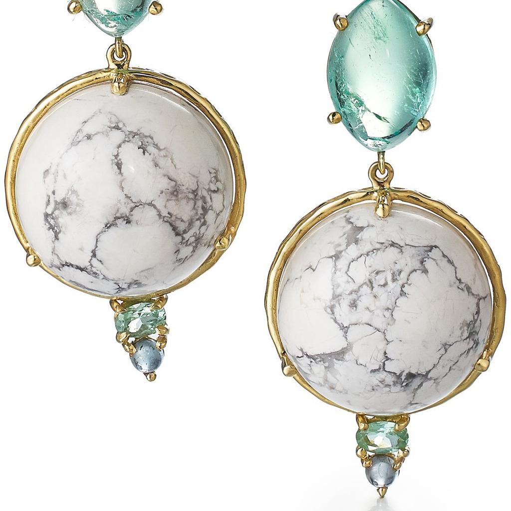 Inspired by the rocks in Milos, Greece, these earrings feature round opalescent aquamarine cabochons, nearly 12 carats of marquise-shaped emerald cabochons, white howlite cabochons with veins of grey, and tourmaline accents. These earrings are part