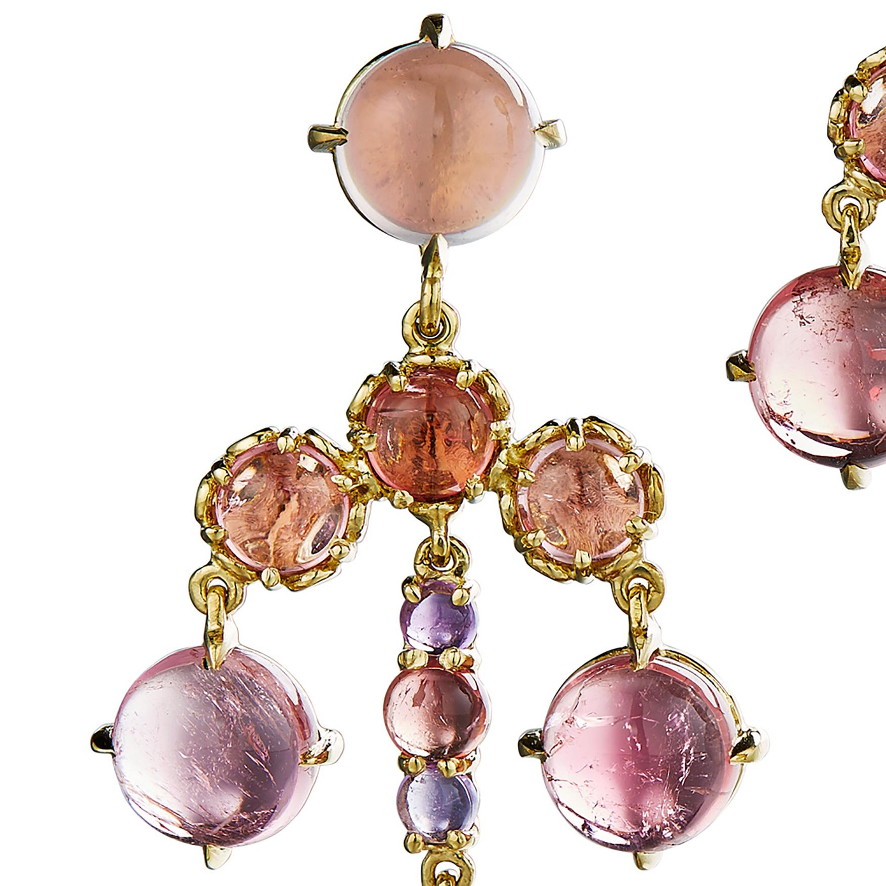 A sumptuous collection of gemstones make up these eye-catching chandelier earrings. Earrings in 18k yellow gold with rose quartz, amethyst, pink tourmaline. For pierced ears with a post backing.

Daria de Koning’s one-of-a-kind cabochon-centric work