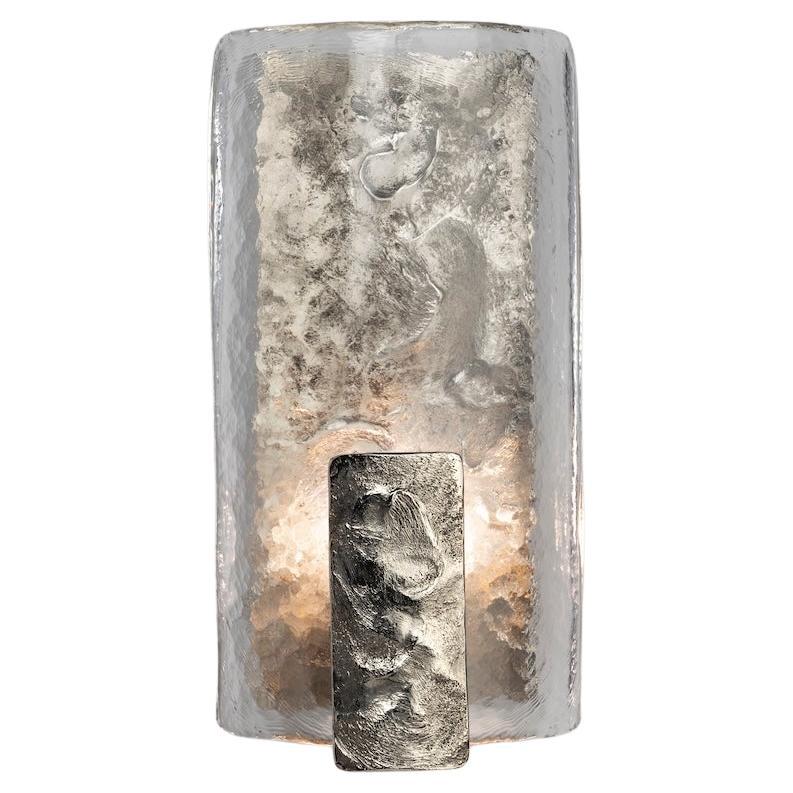A nickel plated version of our Darien Sconce - Hand crafted, textured cast bronze backplate with Murano glass shade and hand crafted cast bronze diffuser.

Requires one E14 small screw bulb. Wired for the EU, we can UL certify for an upcharge.
