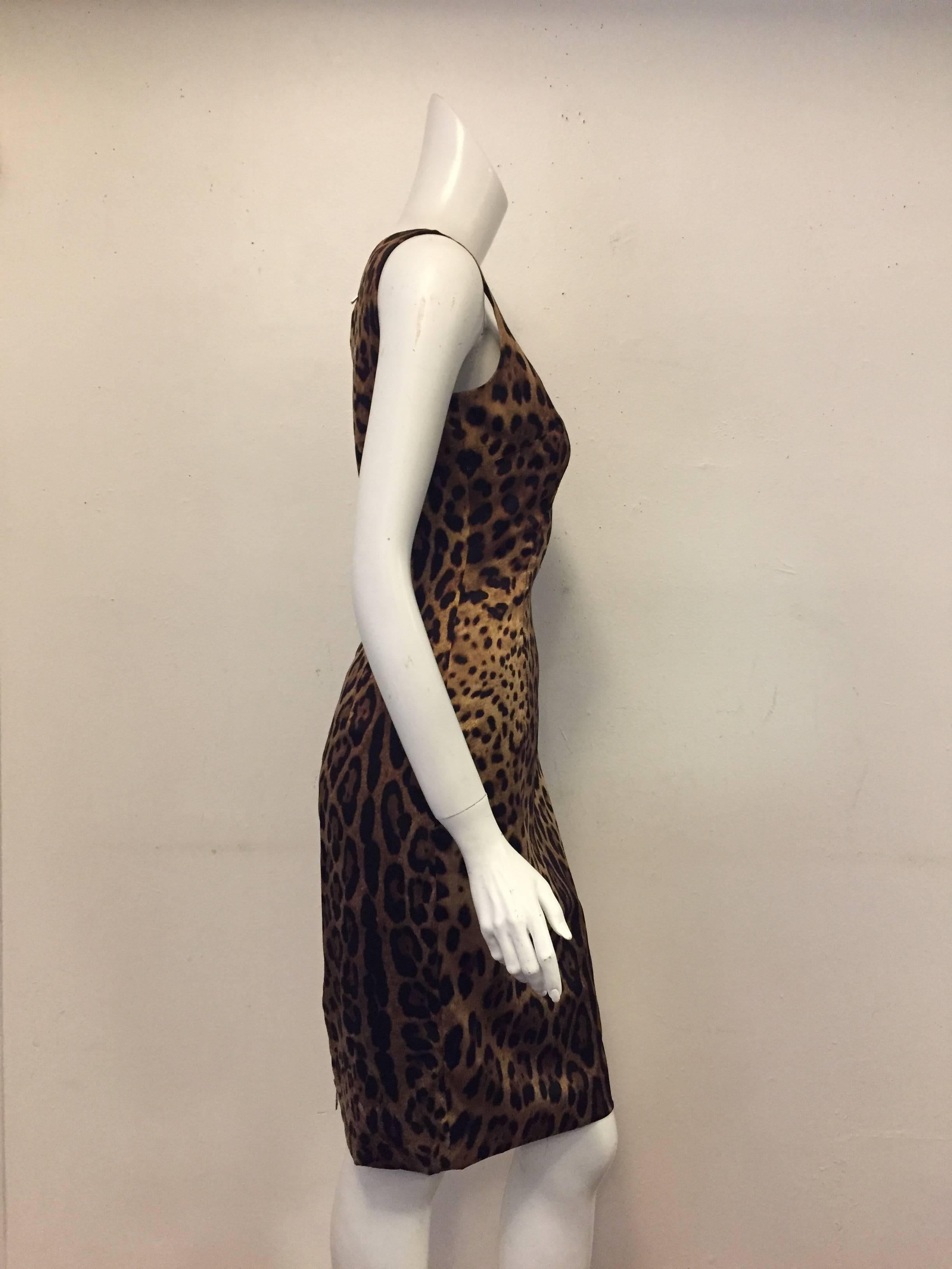 Dolce & Gabbana are known for Sicilian glamour, iconic prints and fashion for the whole family. This brown signature leopard print dress has been carefully made from a silk blend in Italy and features a round neck, a concealed rear zip fastening and