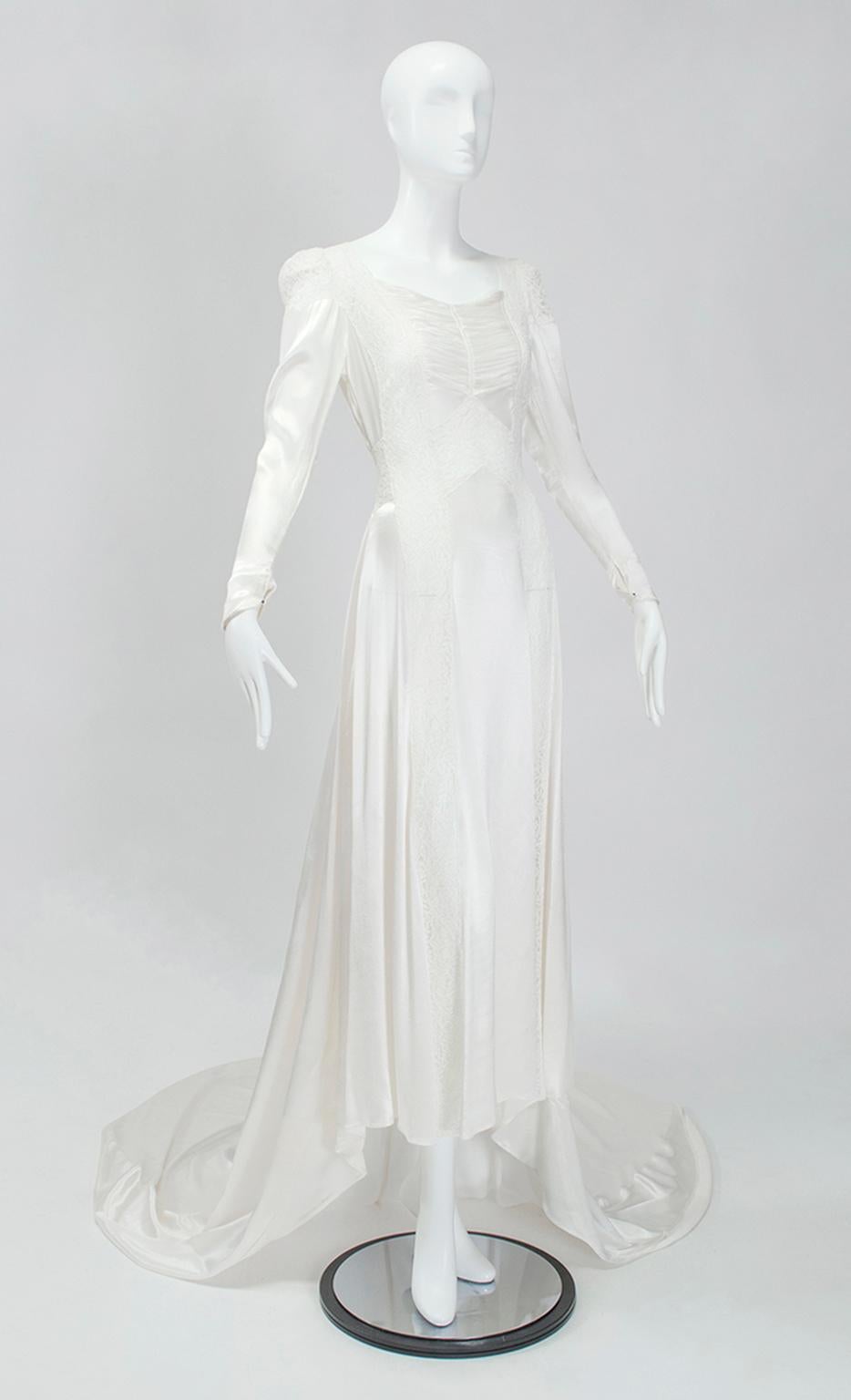 You would be forgiven for thinking this is an uptight wedding gown because of its age and sleeves. Of course we would direct your attention to the transparent lace insets that discourage the use of underwear, and to the bias-cut liquid satin fabric