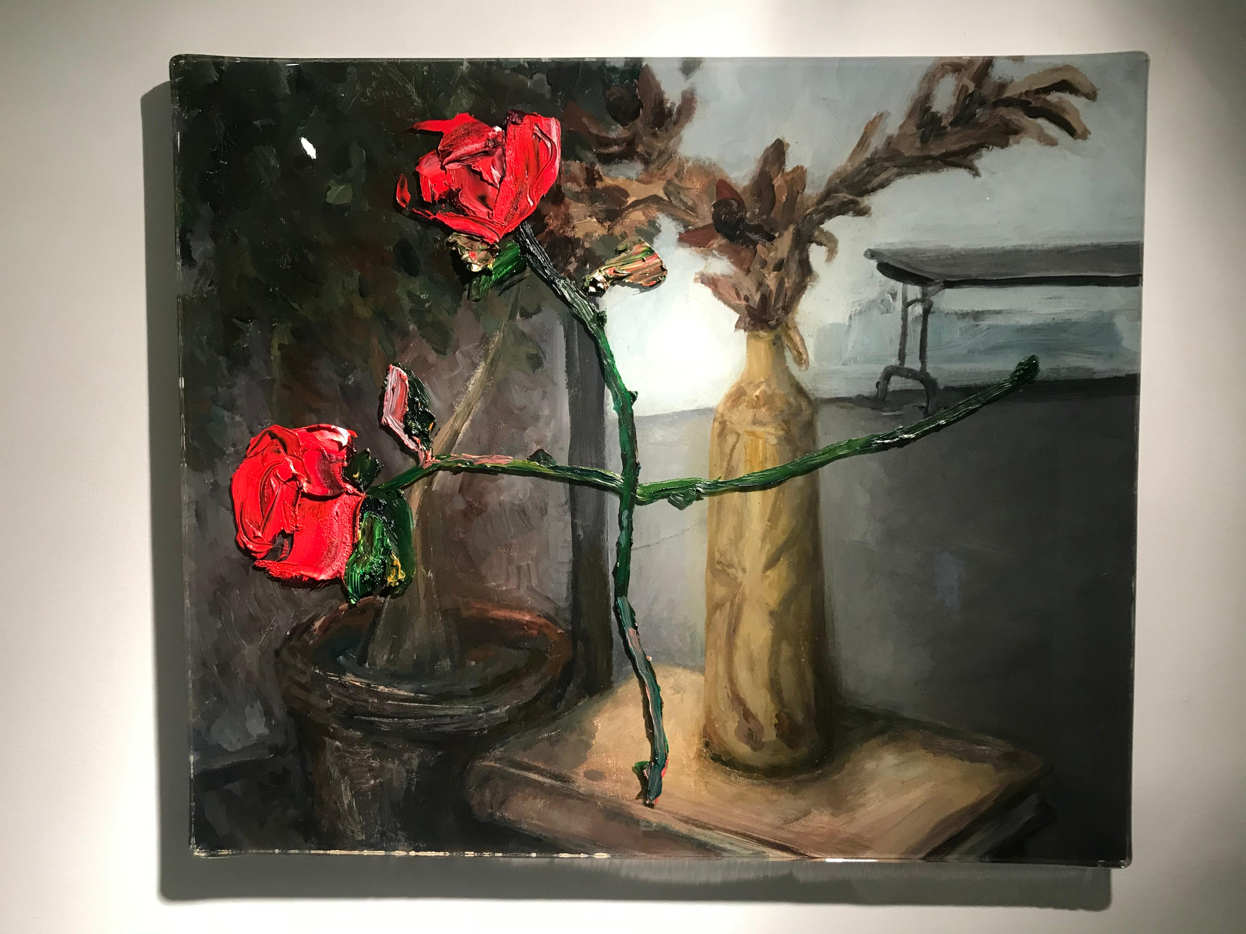 Underneath the two red roses in Darius Yektai's 