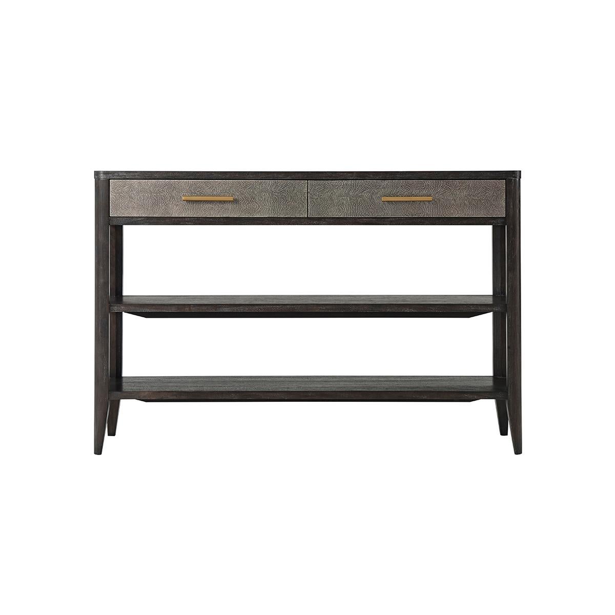 In a dark finish with two Komodo embossed leather panel frieze drawers. The two soft closing drawers with above two lower tier shelves.

Dimensions: 55