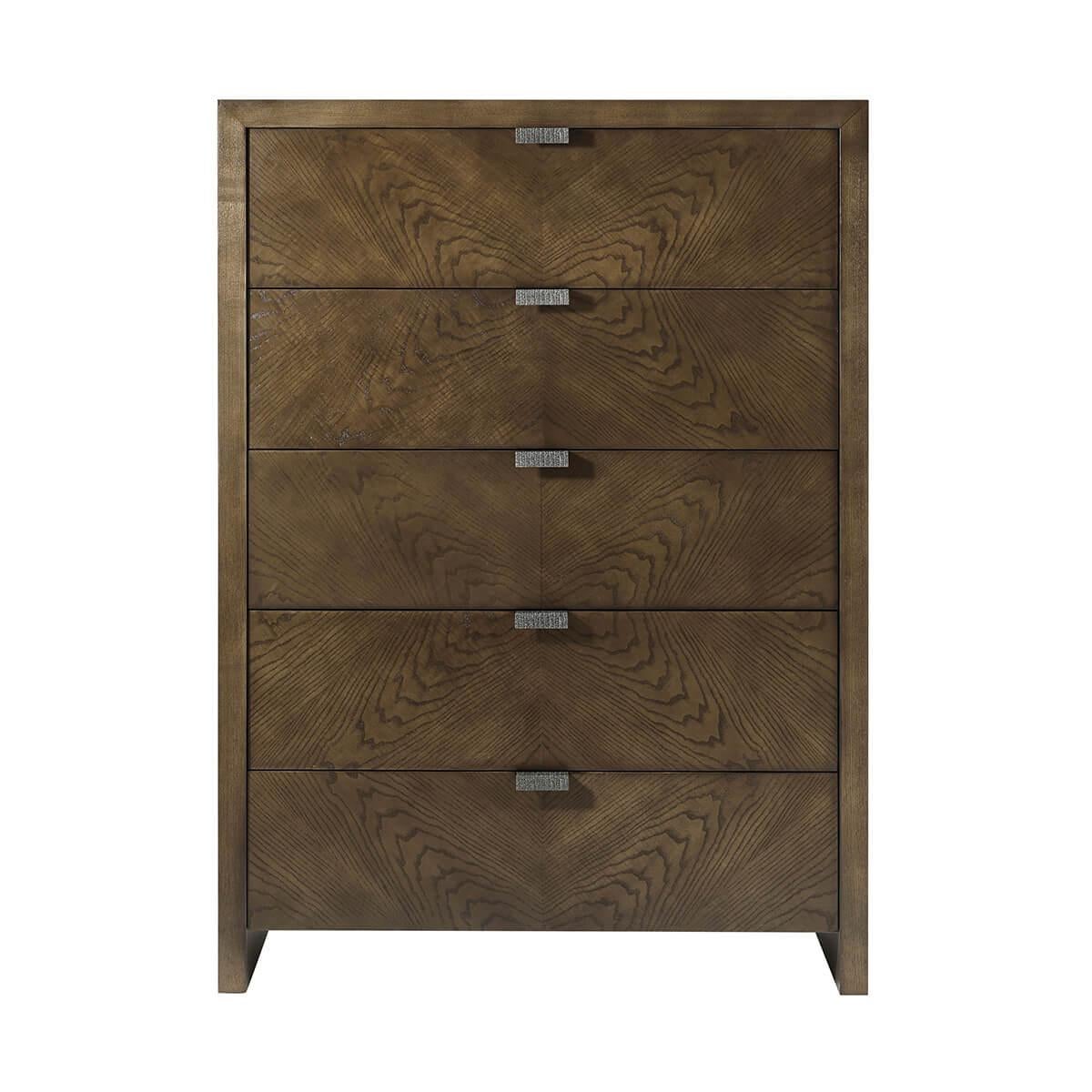 A handsome five-drawer tall bedroom chest made of figured ash in dark Earth finish with textured metal pulls in our Ember finish and soft close drawers.

Dimensions: 40