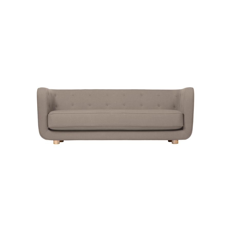 Dark beige and natural Oak Raf Simons Vidar 3 Vilhelm sofa by Lassen
Dimensions: W 217 x D 88 x H 80 cm 
Materials: Textile, Oak.

Vilhelm is a beautiful padded three-seater sofa designed by Flemming Lassen in 1935. A sofa must be able to