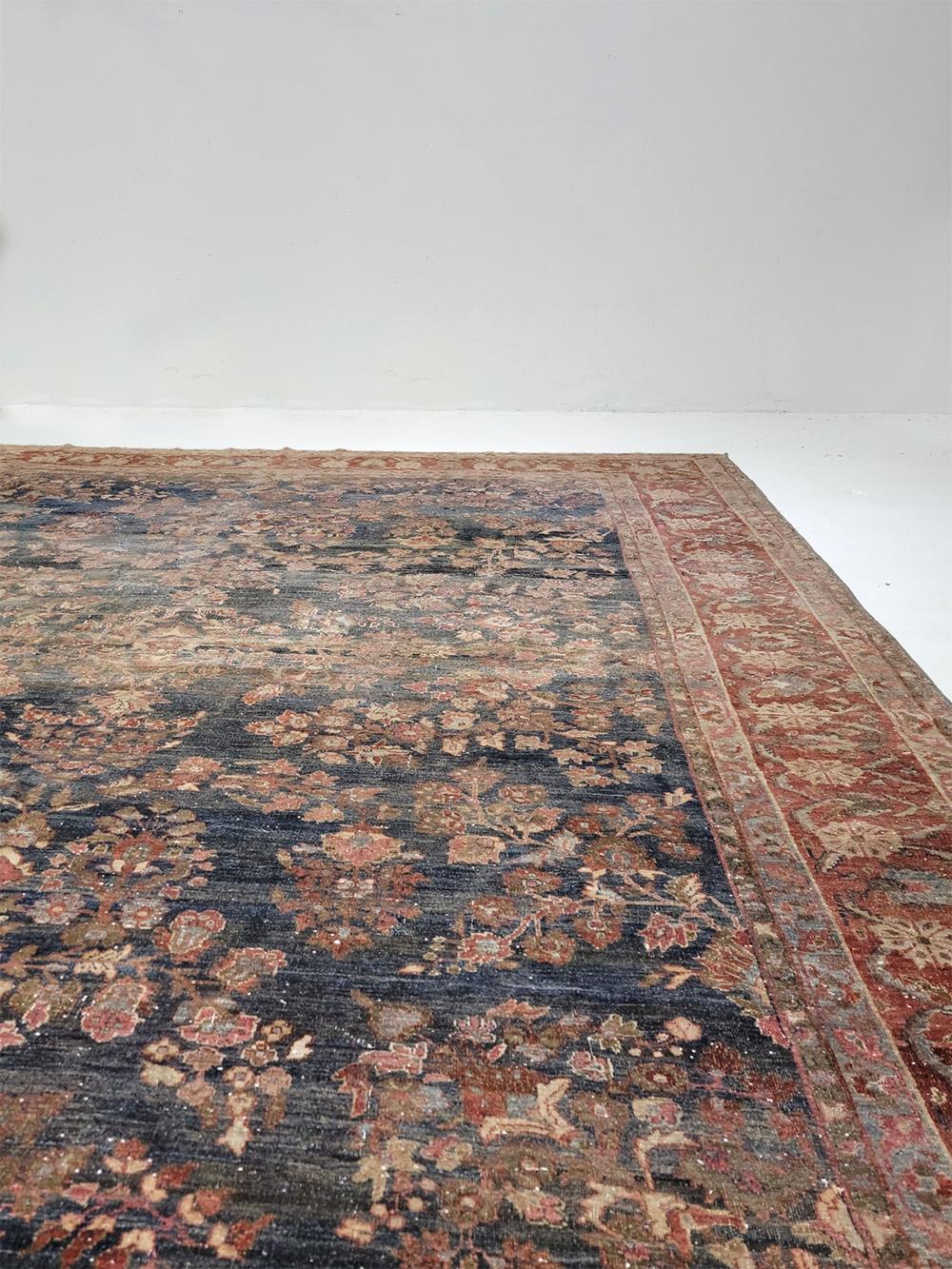 Early 20th Century Dark Blue Antique Persian Sarouk Rug For Sale