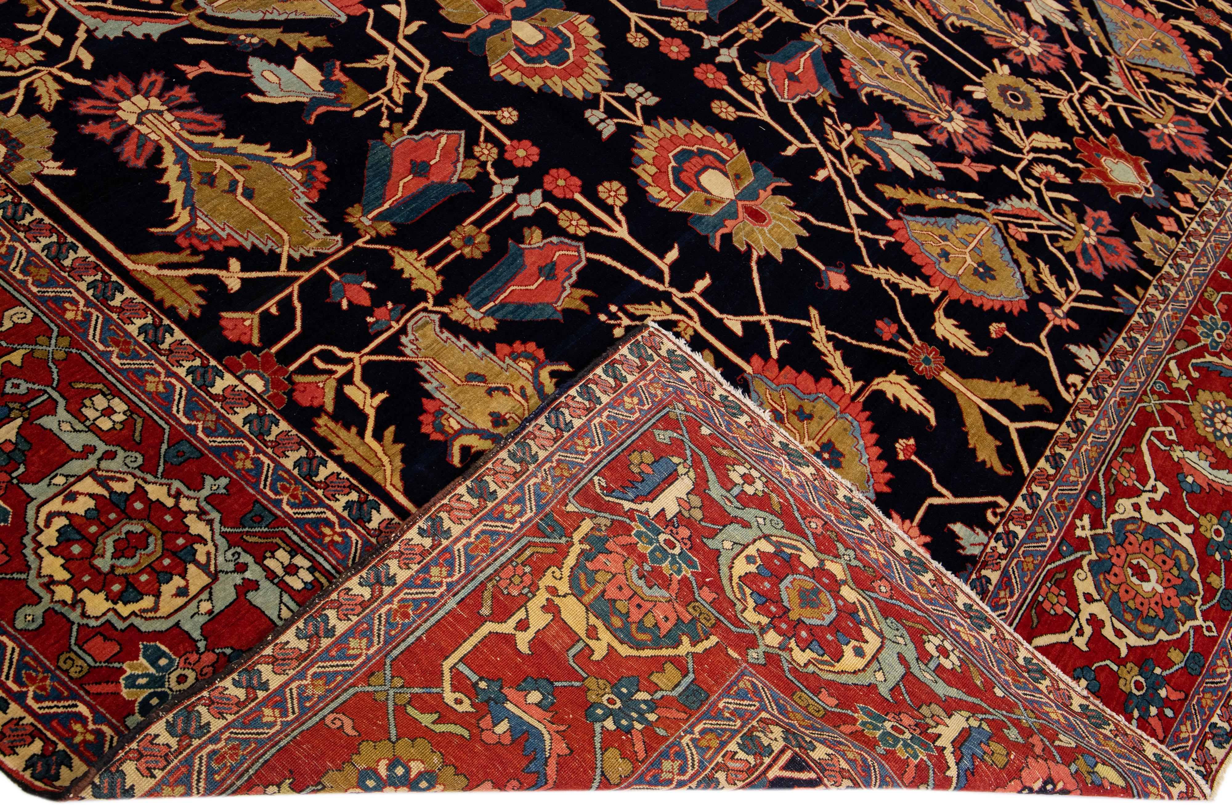 Beautiful Antique Serapi hand-knotted wool rug with a dark blue field. This Persian rug has a red frame and multi-color accents in a gorgeous all-over geometric floral design.

This rug measures: 13' x 17'.

Our rugs are professional cleaning