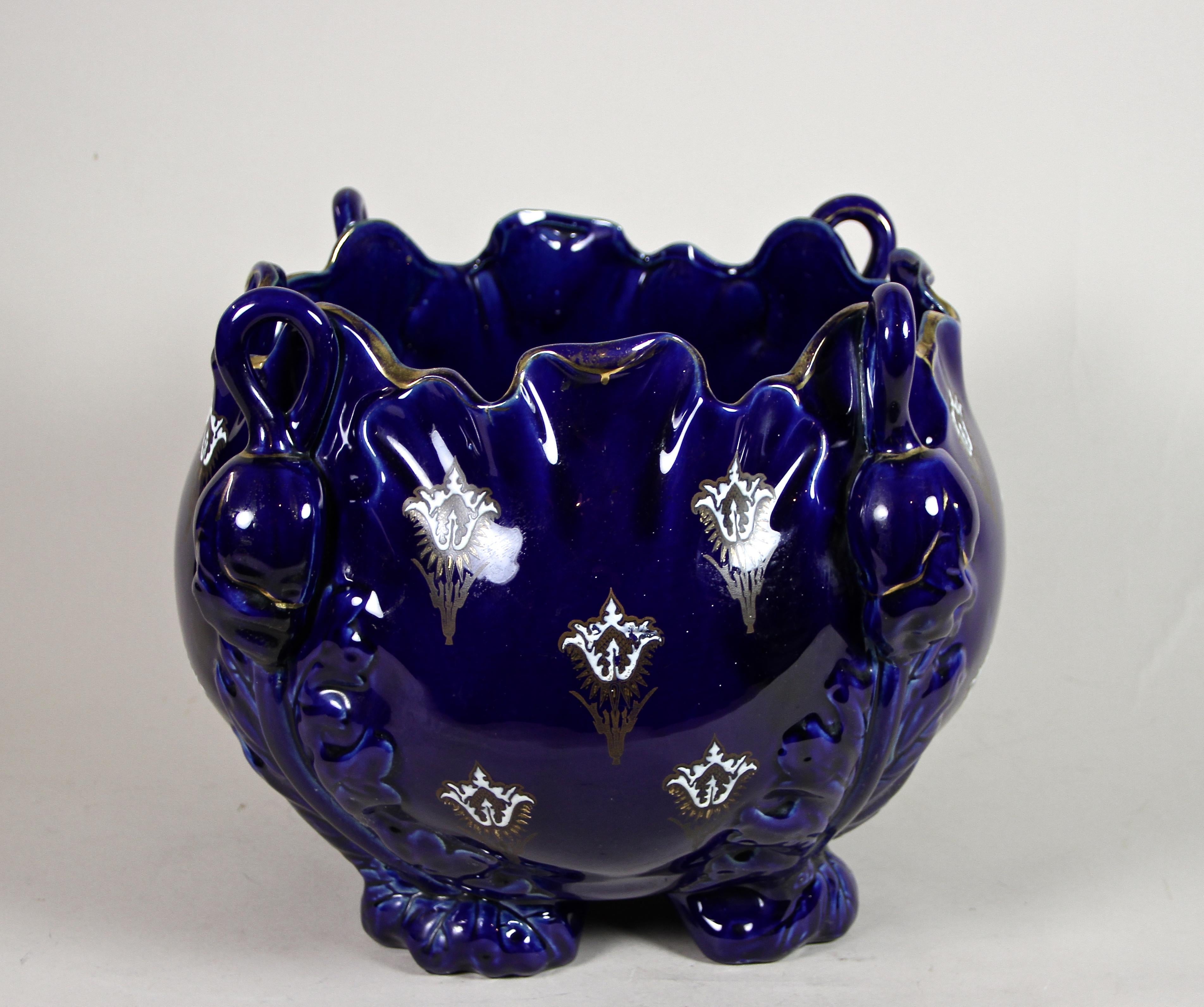 Extraordinary, large Art Nouveau ceramic Cachepot from the period in France around 1915, made by the famous company of K&G Luneville. This rare, dark cobalt blue cachepot impresses with an unusual shaped body and its beautiful floral design showing