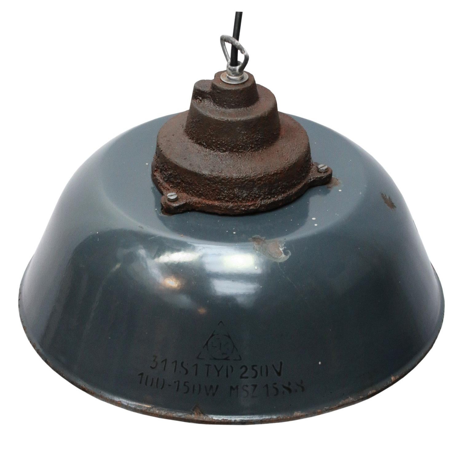 Factory pendant
Dark blue enamel with white interior
Rusty cast iron top.

Weight 3.20 kg / 7.1 lb

Priced per individual item. All lamps have been made suitable by international standards for incandescent light bulbs, energy-efficient and LED