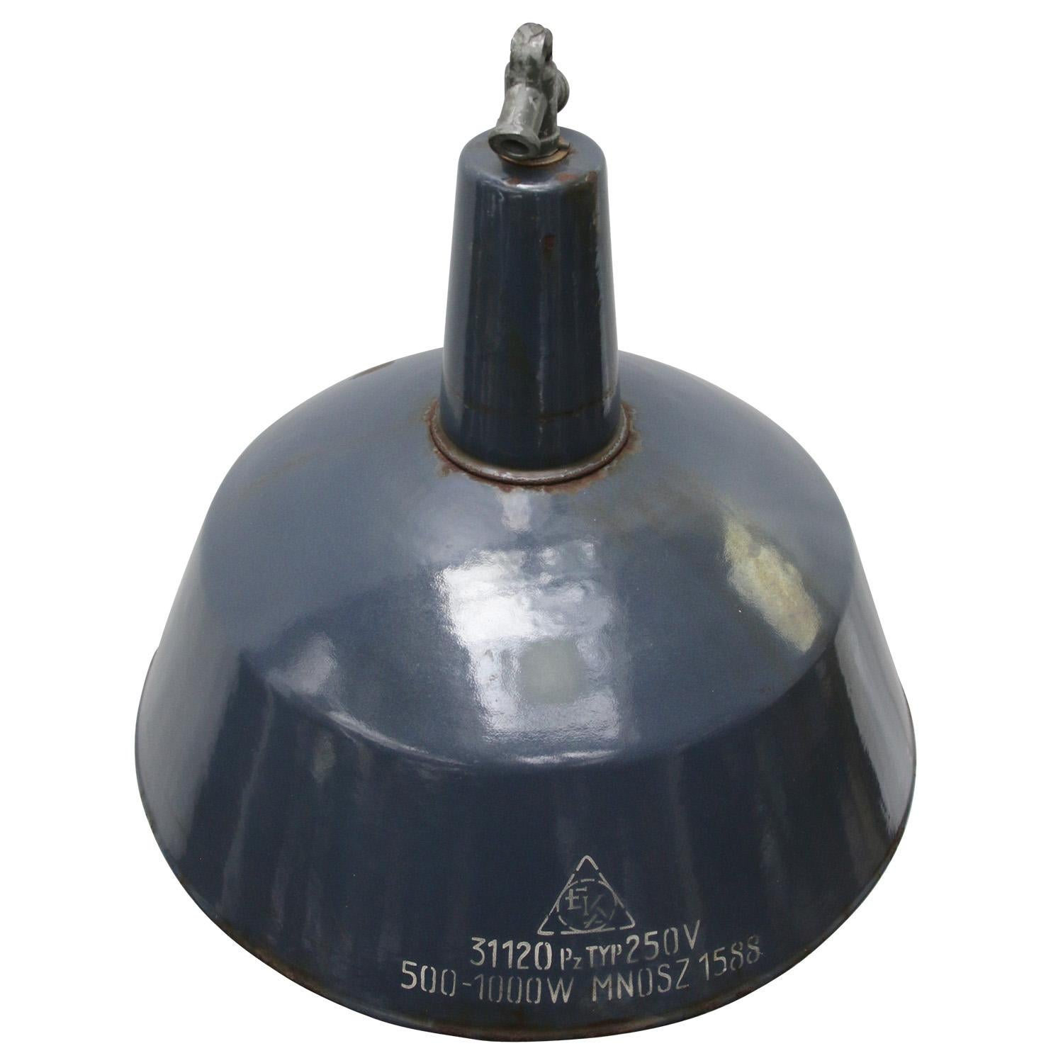 Factory hanging light
Very dark blue enamel, white interior

Measures: weight: 3.00 kg / 6.6 lb

Priced per individual item. All lamps have been made suitable by international standards for incandescent light bulbs, energy-efficient and LED bulbs.