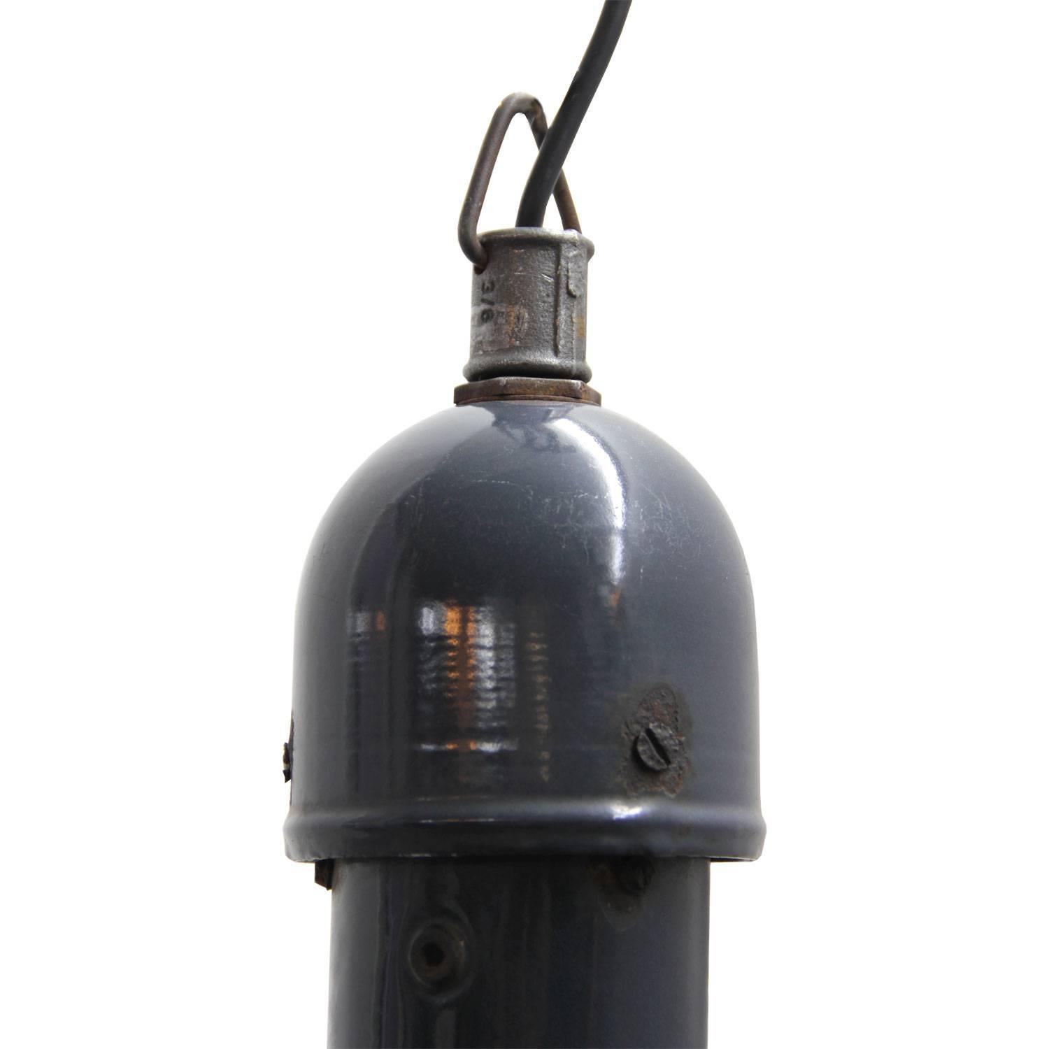 Industrial factory lamp.
Dark blue enamel
white interior 
cast iron top

Weight: 2.3 kg / 5.1 lb

Priced per individual item. All lamps have been made suitable by international standards for incandescent light bulbs, energy-efficient and LED