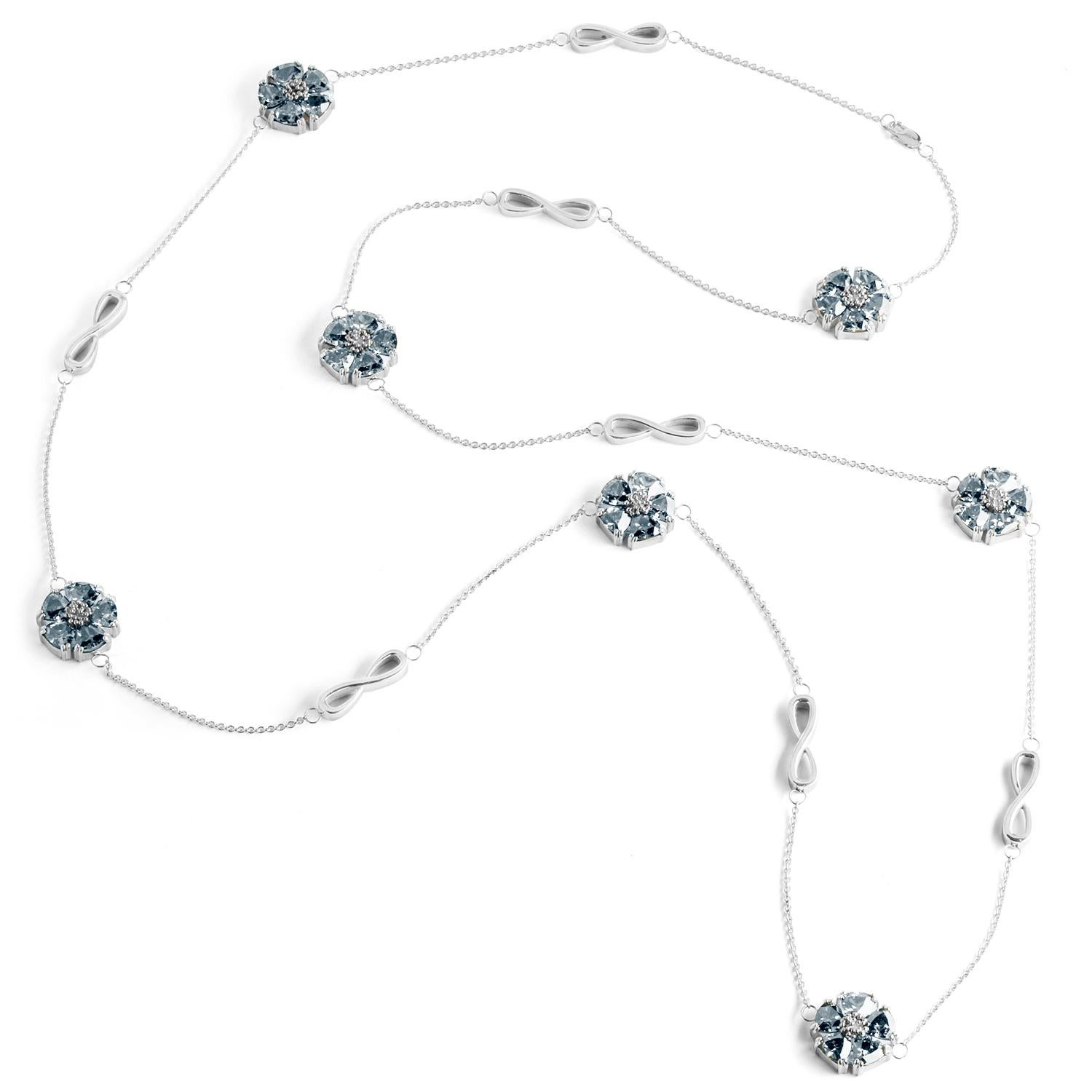 Designed in NYC

.925 Sterling Silver 15 x 7 mm Dark Blue Sapphire Blossom Stone and Infinity Lariat Necklace. No matter the season, allow natural beauty to surround you wherever you go. Blossom stone and infinity lariat necklace: 

Sterling silver