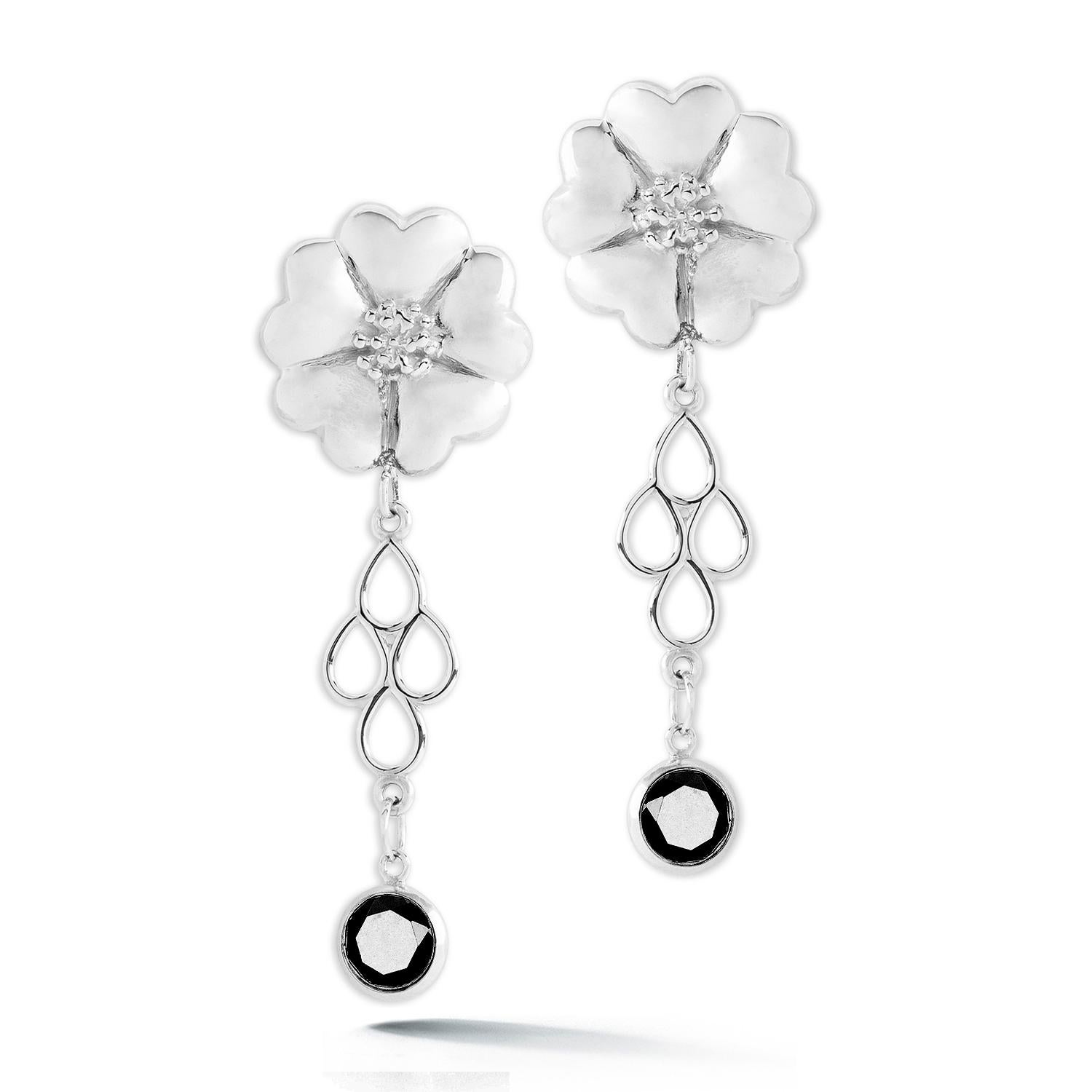 Designed in NYC

.925 Sterling Silver 2 x 6 mm Dark Blue Topaz Blossom Stone Chandelier Earrings. No matter the season, allow natural beauty to surround you wherever you go. Blossom stone chandelier earrings: 

	Sterling silver 
	High-polish finish