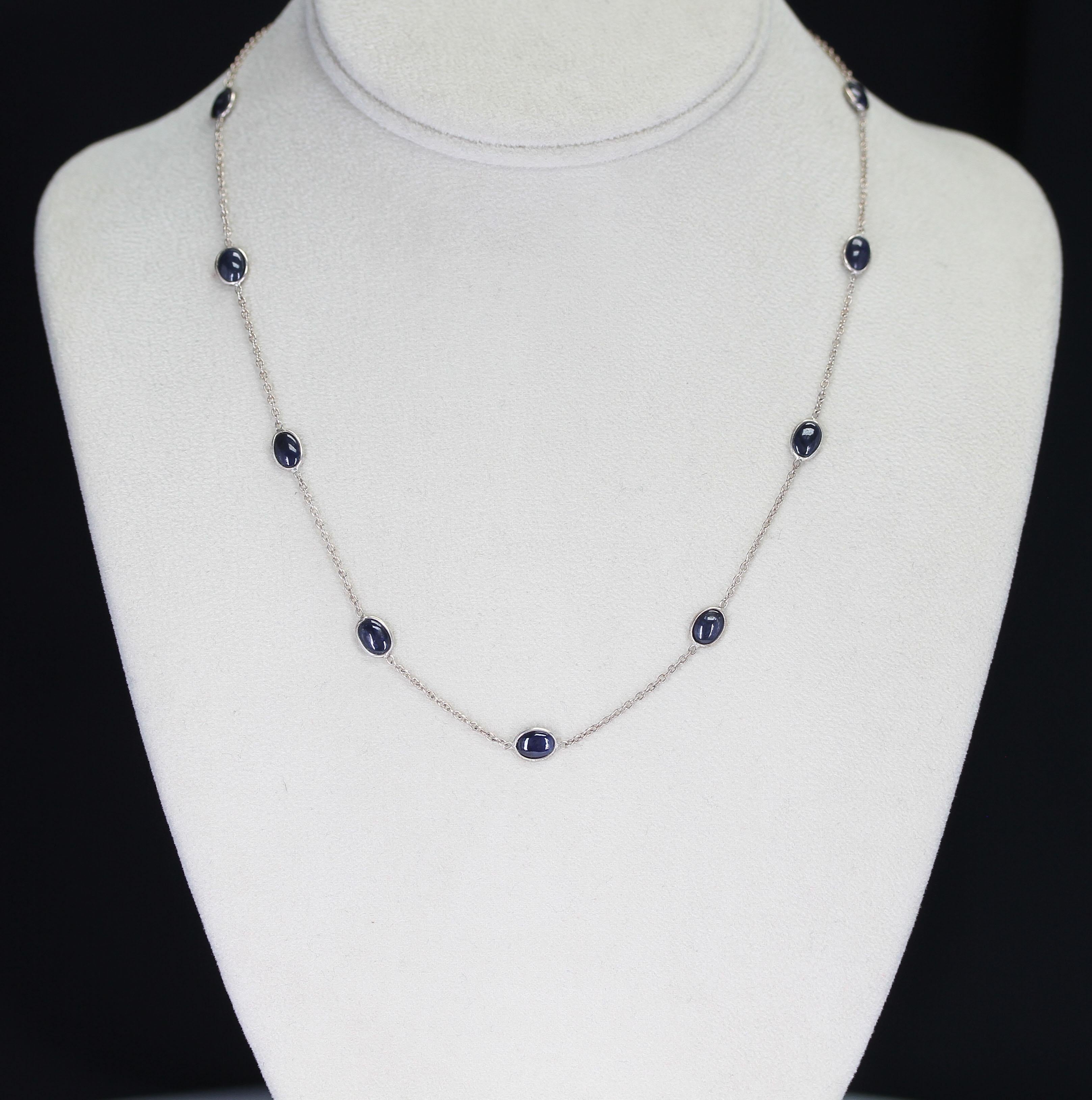 A dainty and everyday-wear Dark Blue Sapphire cabochon necklace in silver. Weight: Approximately 15 carats. 