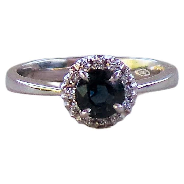 Dark Blue Sapphire Round 0.6K Diamonds 0.10K White Gold Engagement Ring For Sale
