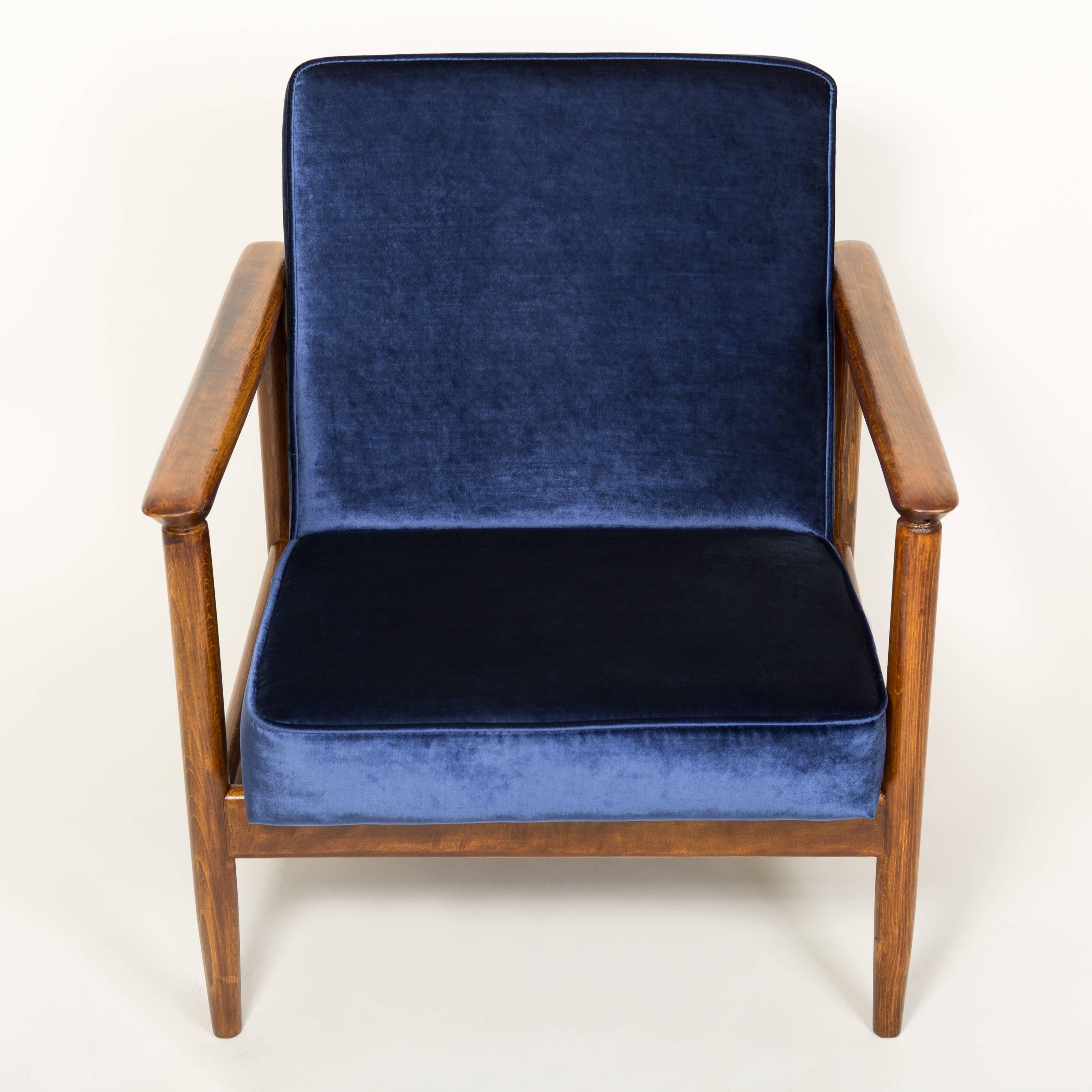 Beautiful armchair model GFM-142, designed by Edmund Homa. The armchair was made in the 1960s in the Gosciecinska Furniture Factory. Frame is made from solid beech wood. The GFM-142 armchair is regarded one of the best Polish armchair design from