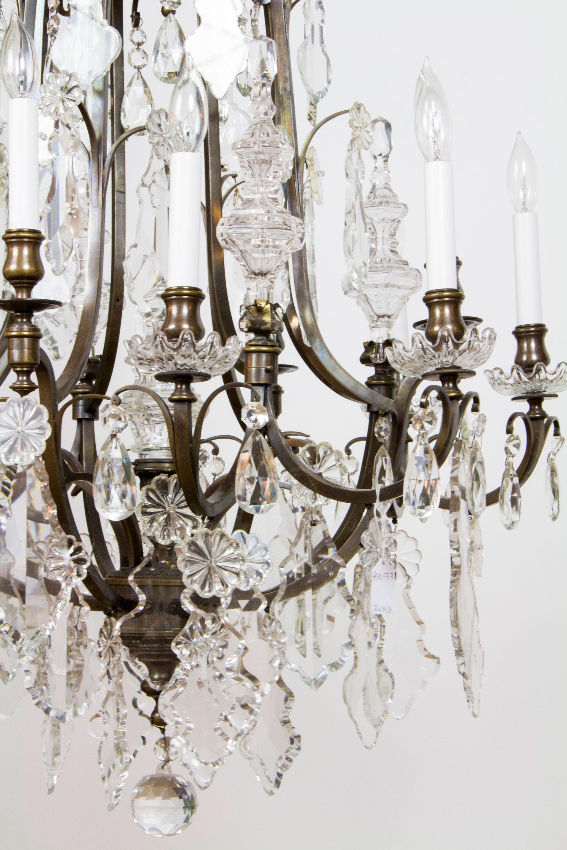 Twelve light chandelier, 
Darkened bronze with crystals. Mid 20th Century. Completely Rewired and Restored, UL Listed.