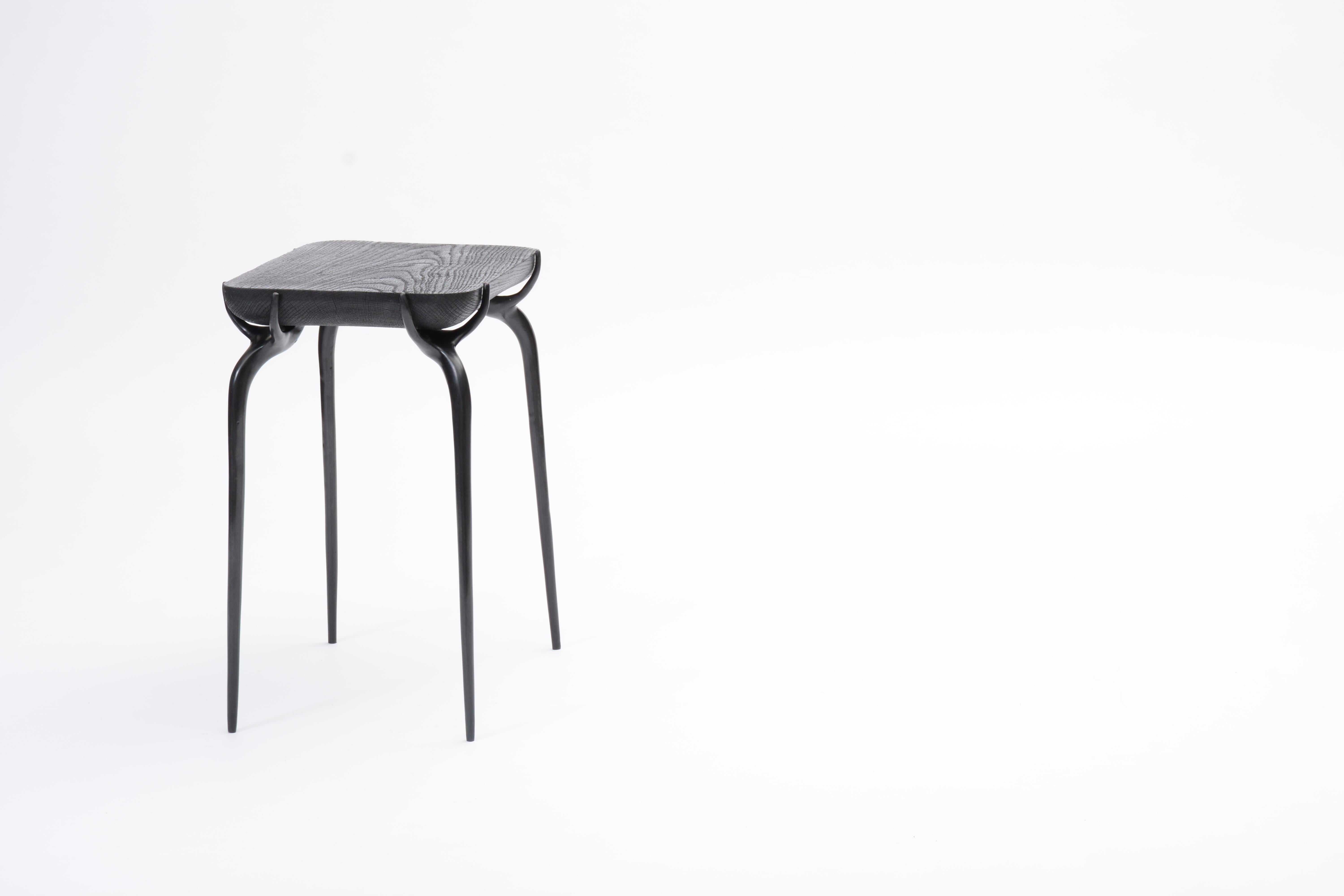 AVAILABLE NOW AND READY TO SHIP! 

A versatile Jewel Side Table with burnt black oak top, and cast bronze base with black finish by Elan Atelier

The jewel side table is inspired by a contemporary sculpture in mediums of wood, metal, and stone. The