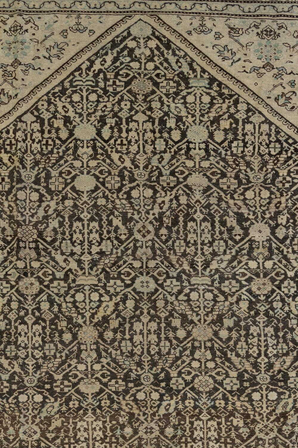 Antique Persian Mahal

Circa: 1920. Low pile

Wear notes: none

Good condition. Deep blackened brown field with warm tan and blue accents. Suitable for high traffic areas and dining rooms. 

Wear Guide:
Vintage and antique rugs are by