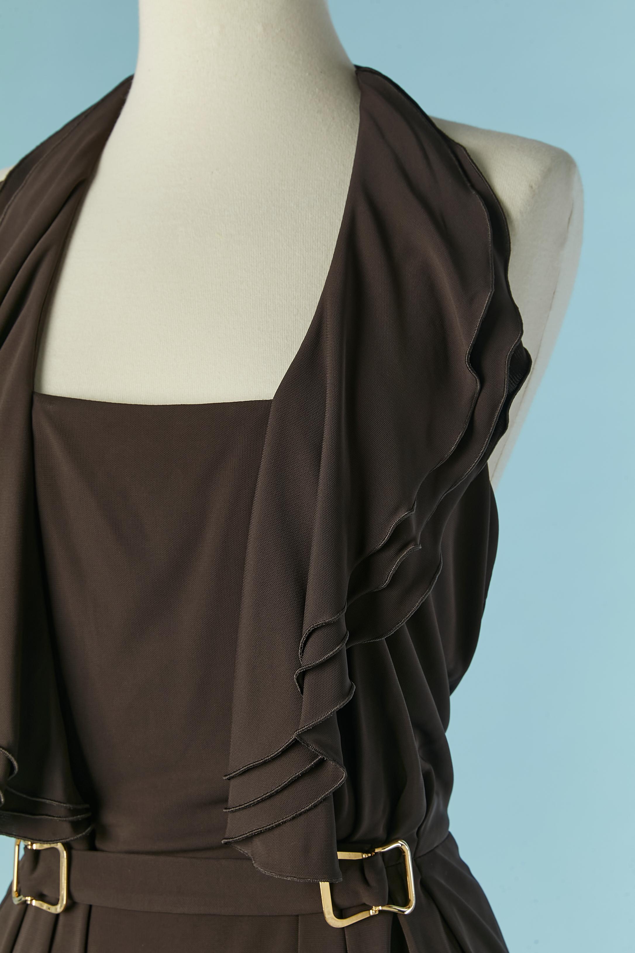 Dark brown backless rayon jersey evening dress with ruffles and buckle. Lining: 65% acetate, 35% nylon. Ruffles along the neckline and bust. Zip closure on the middle back + hook&eye. Elastic band under-bust. 
SIZE 38 (Fr) M 