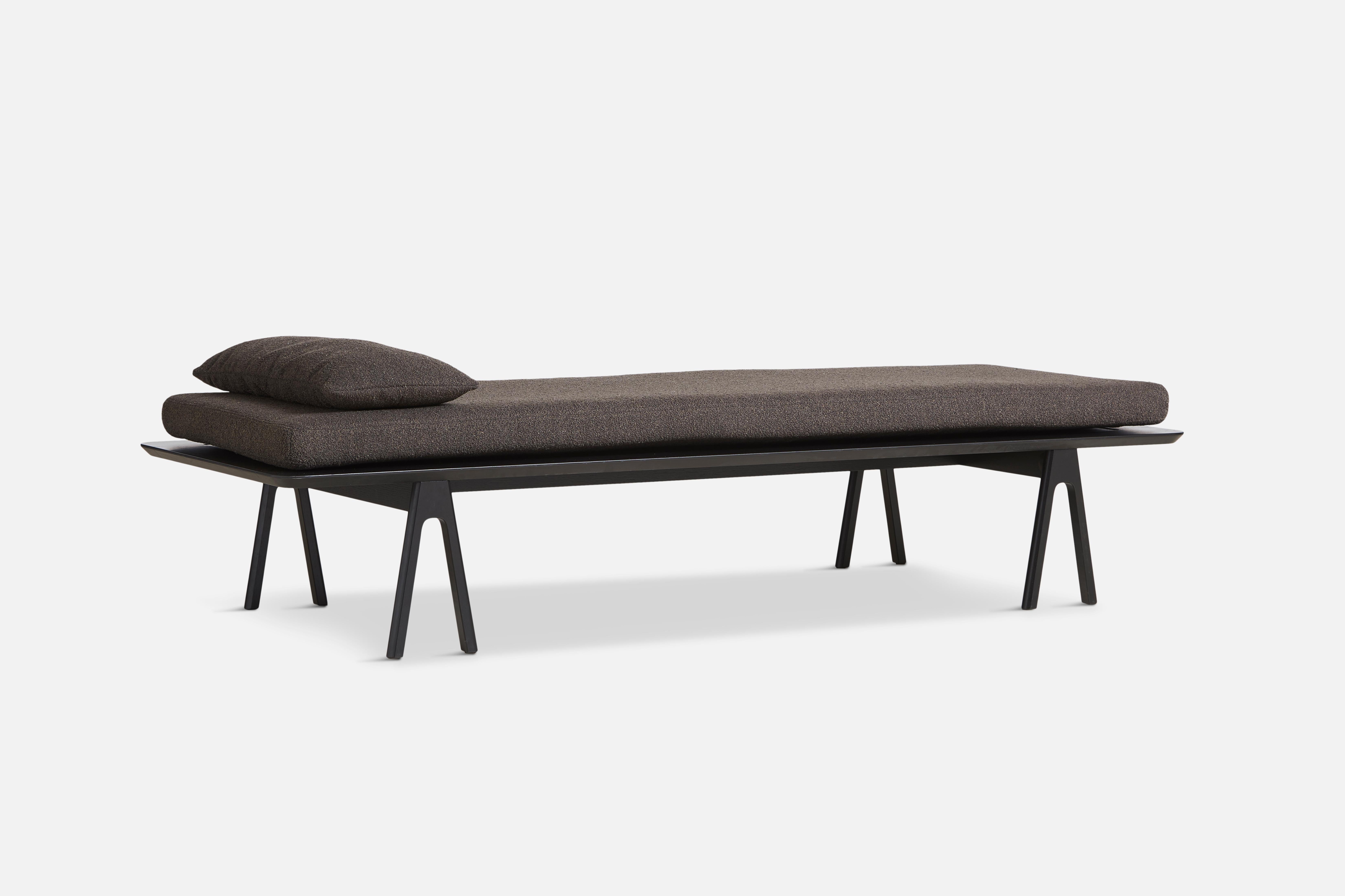 Dark brown boucle level daybed with pillow by Msds Studio.
Materials: Foam, oak, boucle.
Dimensions: D 76.5 x W 190 x H 41 cm // D 23.5 x W 67 x H 8.5 cm.
Also available in different colors.

The founders, Mia and Torben Koed, decided to put