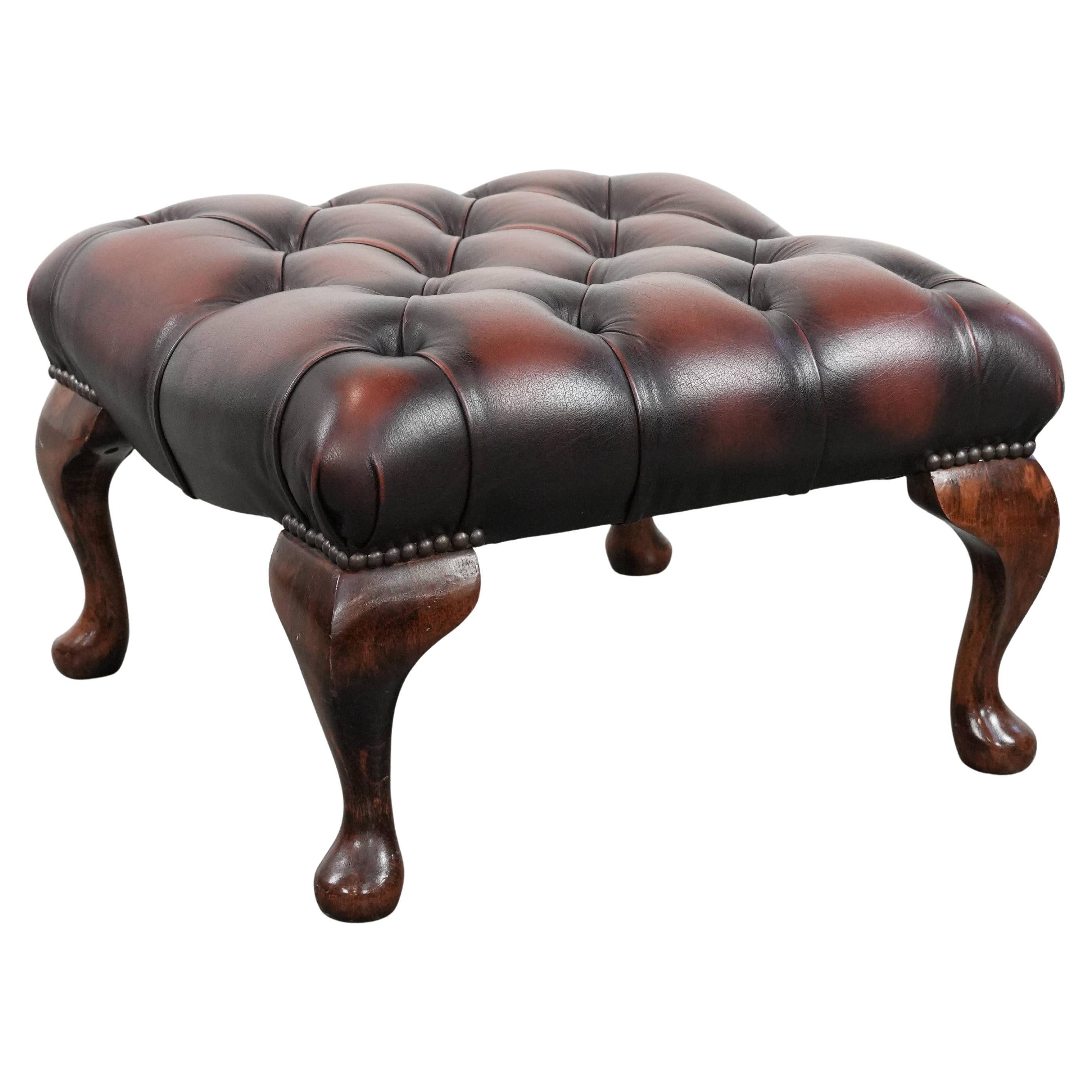 Dark brown chesterfield ottoman in cowhide leather