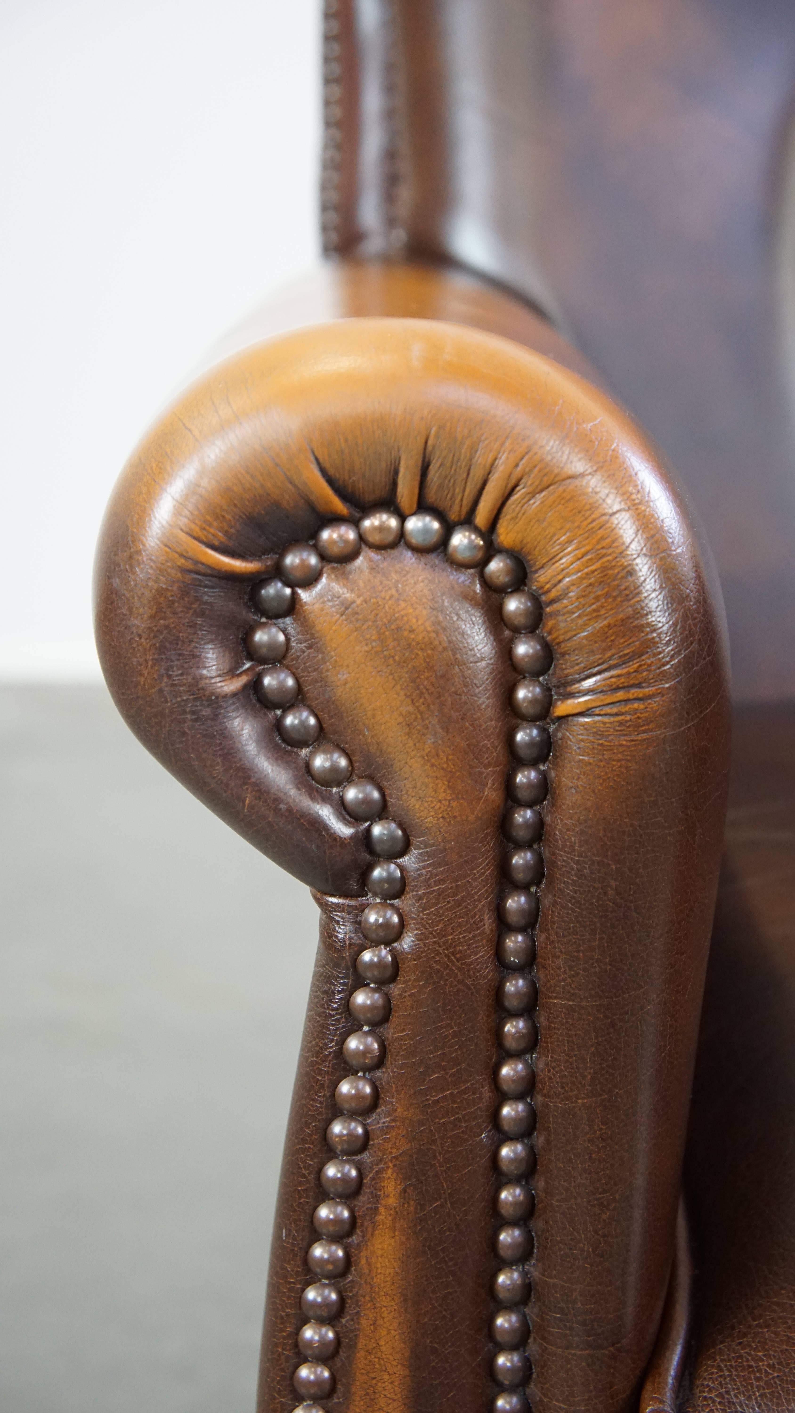 Dark brown cow leather English style armchair with a robust appearance For Sale 4