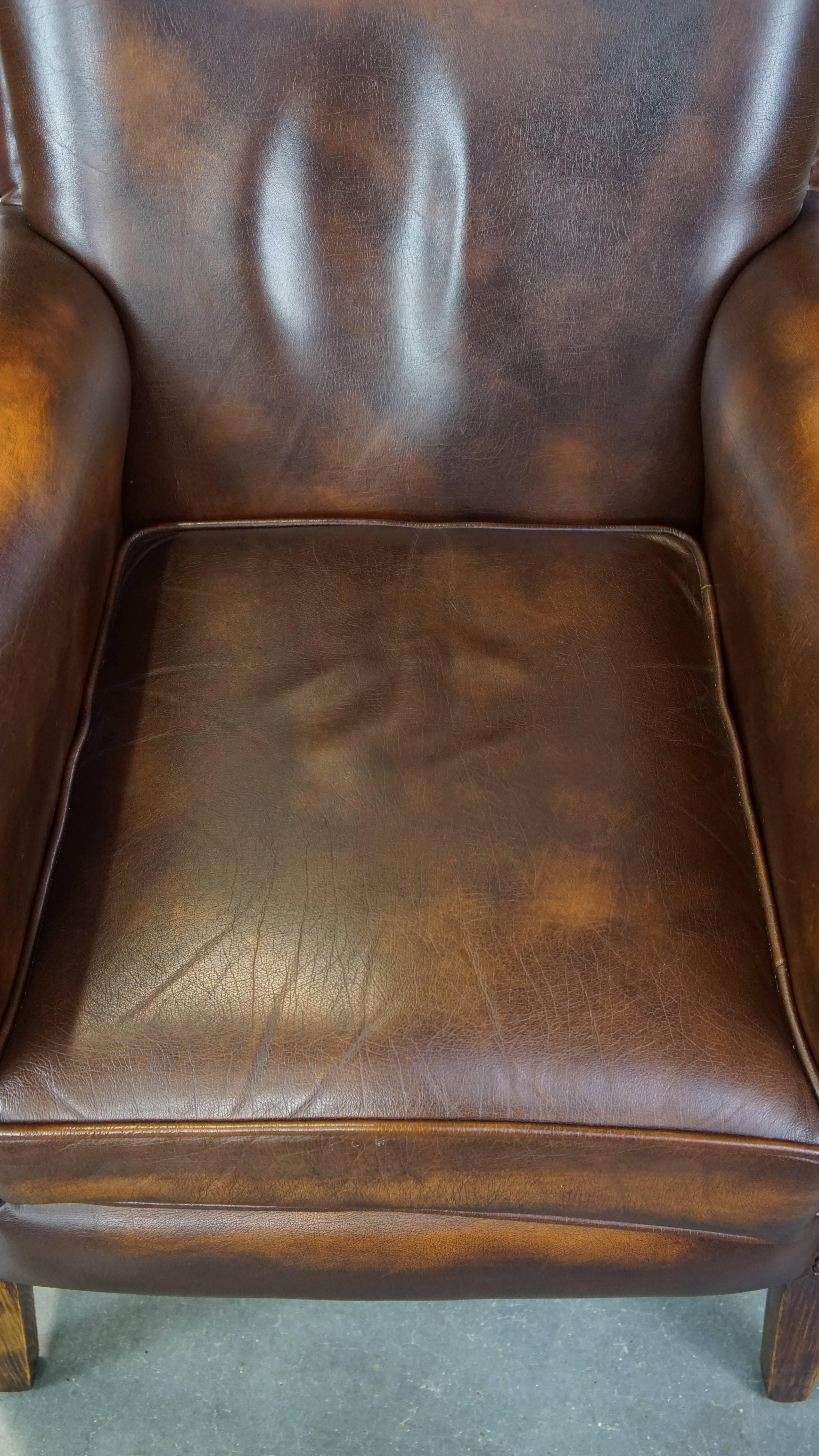 Cowhide Dark brown cow leather English style armchair with a robust appearance For Sale