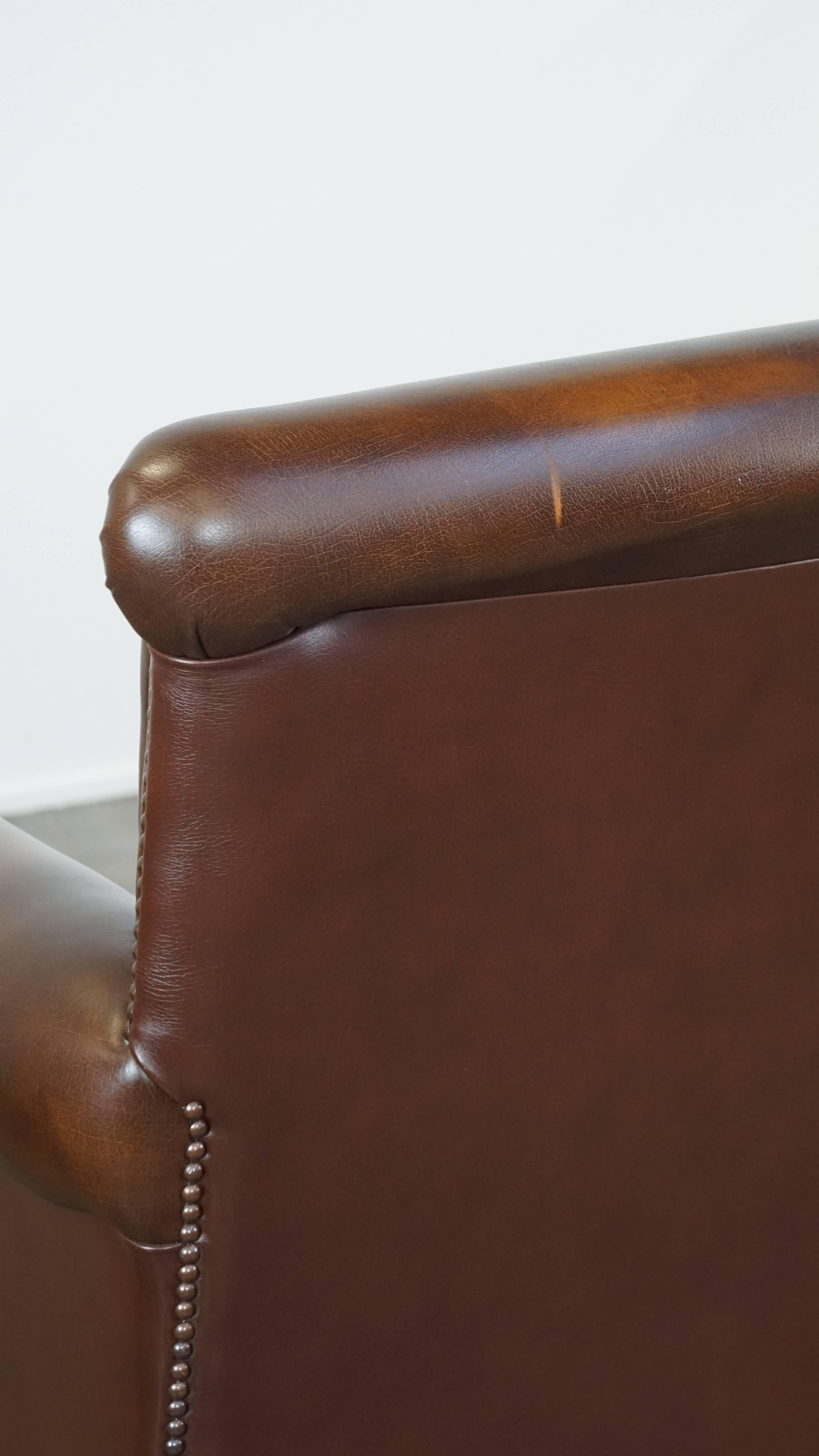 Dark brown cow leather English style armchair with a robust appearance For Sale 3