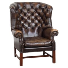 Sillón Chesterfield Wingback de piel de vaca marrón oscuro