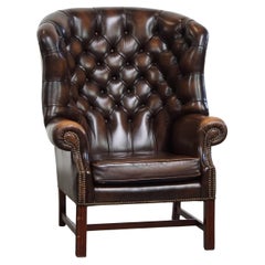 Sillón Chesterfield Wingback de piel de vaca marrón oscuro
