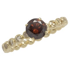 Dark brown diamond ring with brilliant cuts in 14 carat gold