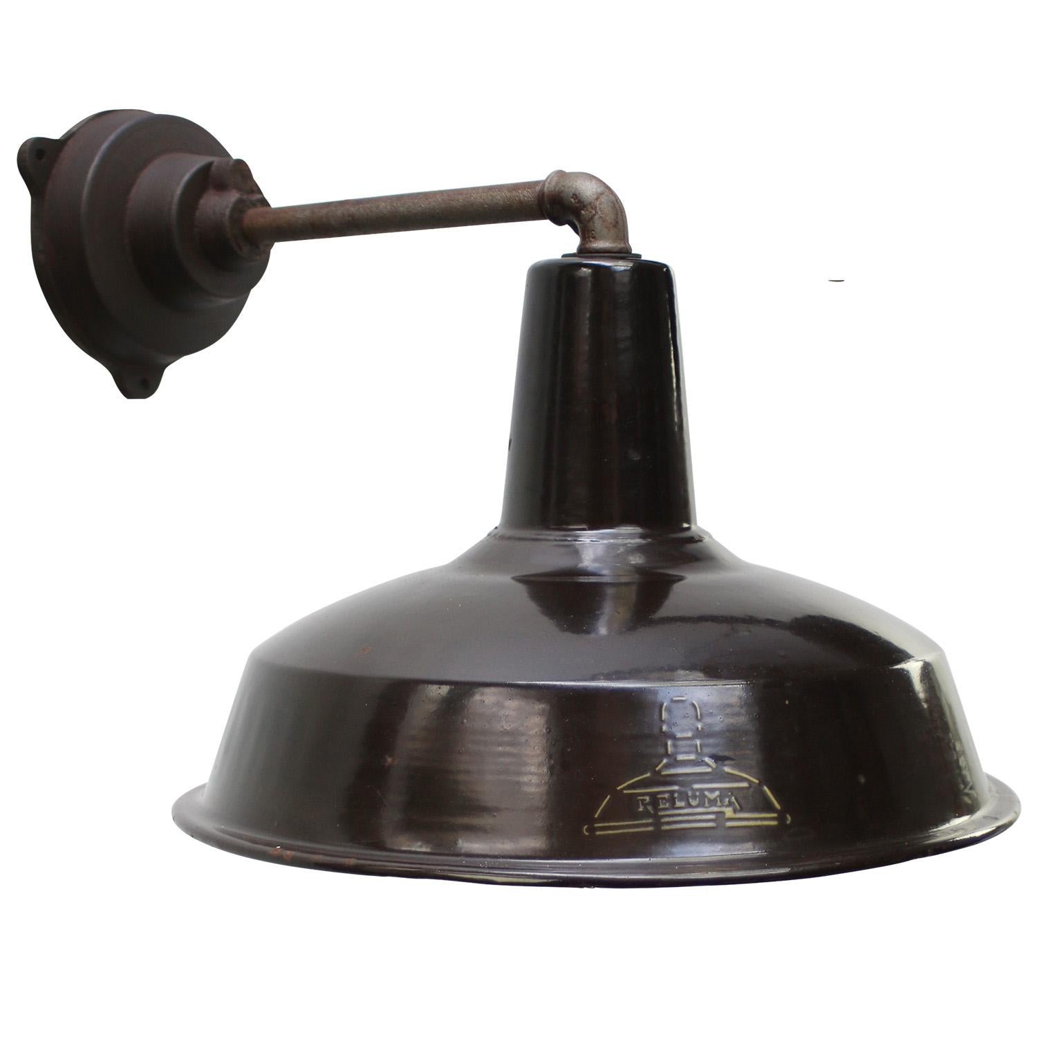 Belgian Factory Wall Light by Reluma, Belgium
Dark brown enamel, white interior

diameter cast iron wall piece: 12 cm, 3 holes to secure

Weight: 3.20 kg / 7.1 lb

Priced per individual item. All lamps have been made suitable by international