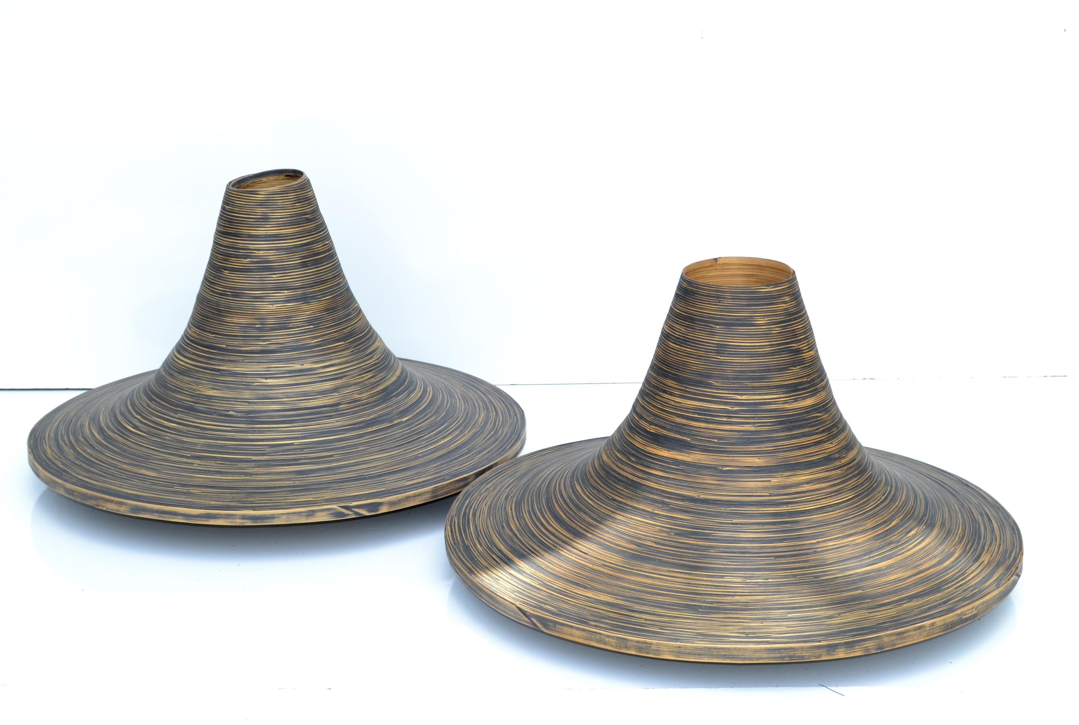 Dark Brown Finish decorative indoor planters in swirled cane into this cone shaped Vessel.
Coming from a famous Florist in Paris, France.
The wood's natural coloring show of tones ranging from light beige, Taupe to  a dark brown striped with