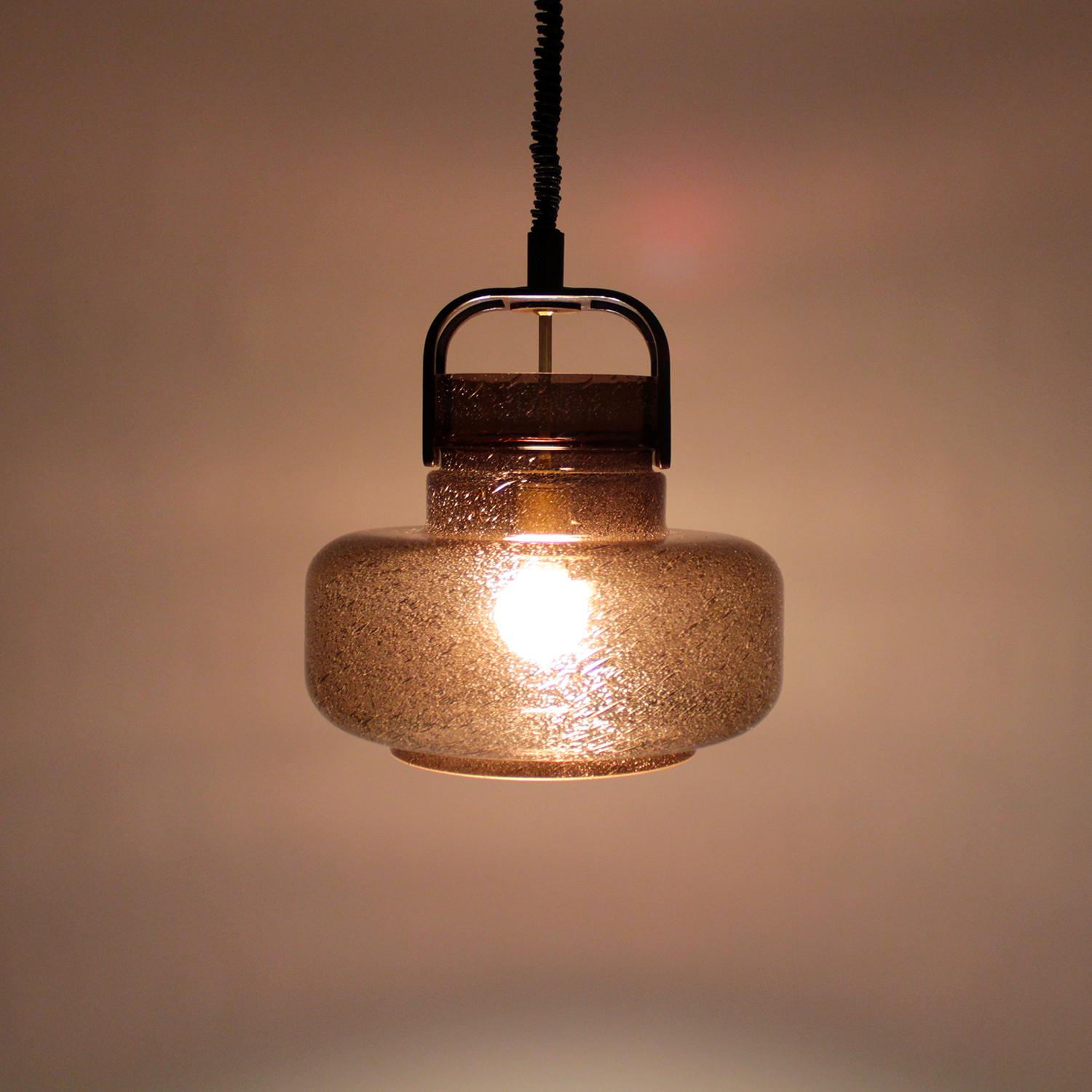 Dark brown glass pendant with wooden handle on top- 1970s Scandinavian lighting design by Jan Johansson for Flygsfors Sweden.

Voluminous dark brown blown glass shade with beautiful air bubbles incorporated in the glass. Features a wooden 