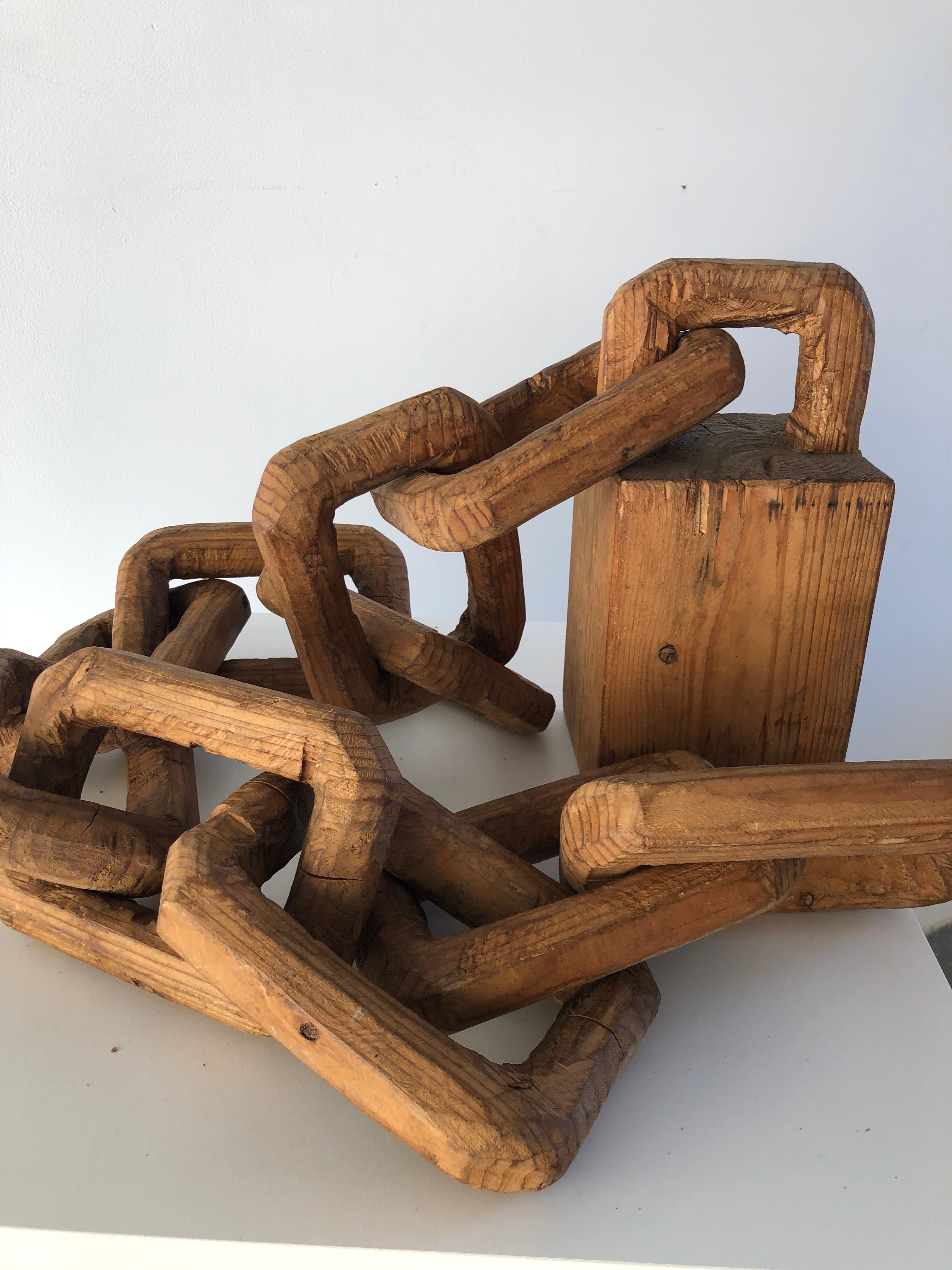 Sourced in Japan, estimated to come from early 20th century of hand carved wood connecting. each link and base. Elegant piece can lay on ground or on pedestal as shown.