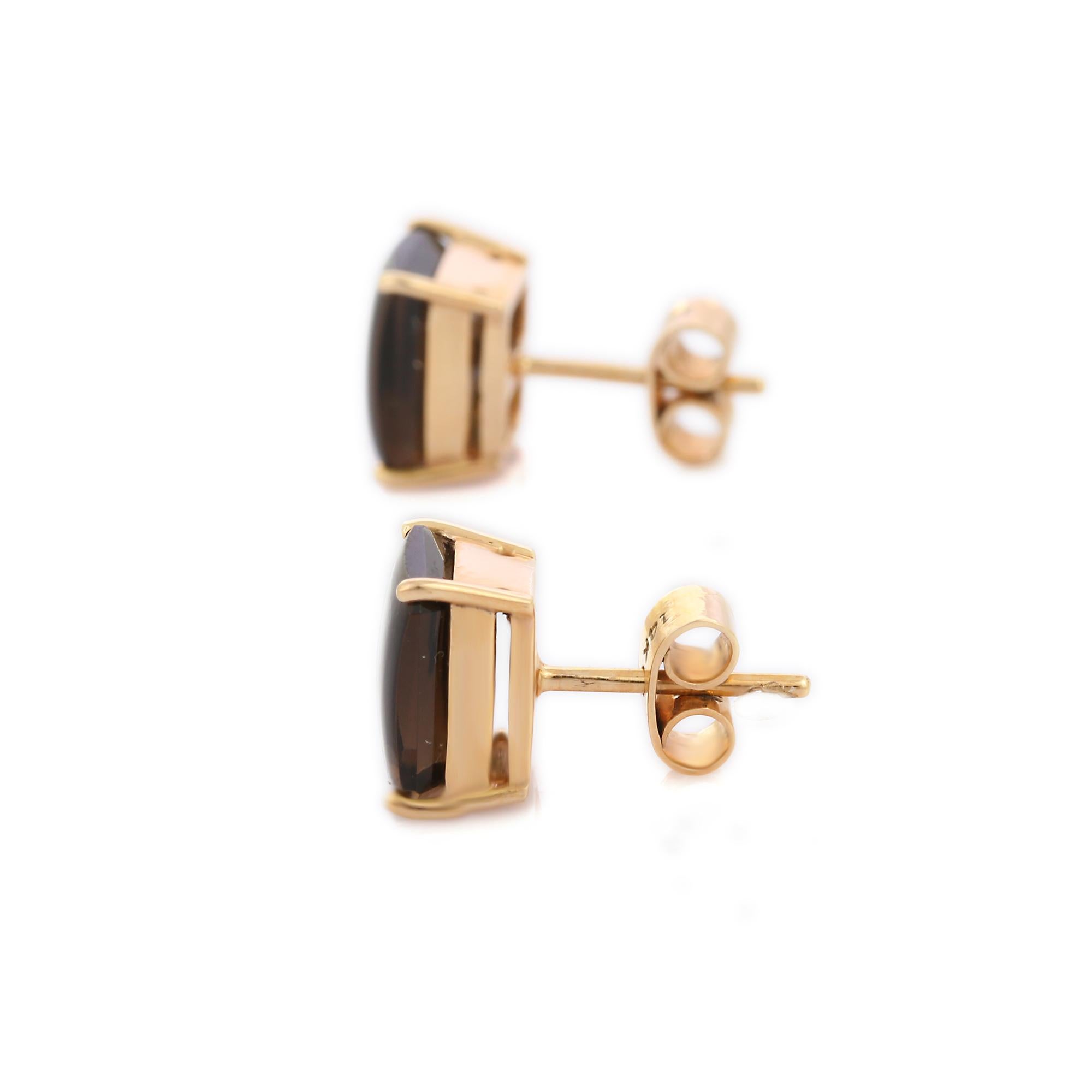 Studs create a subtle beauty while showcasing the colors of the natural precious gemstones.

Octagon cut brown smoky quartz studs in 14K gold. Embrace your look with these minimal stunning pair of earrings suitable for any occasion to complete your