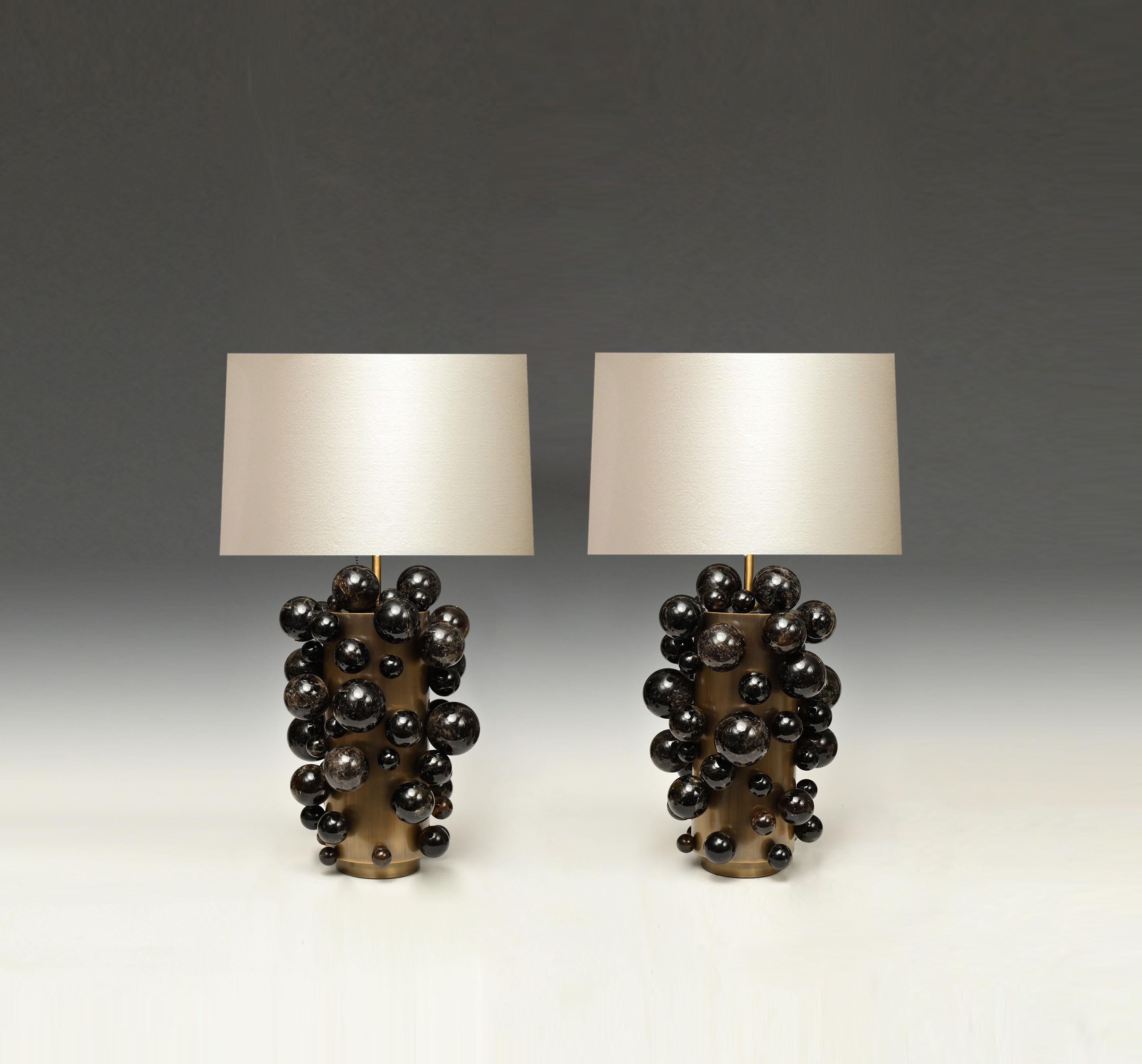 A pair of luxury dark rock crystal quartz bulb lamps with antique brass frames. Created by Phoenix Gallery, NYC.
Each lamp installed two sockets.
To the top of the rock crystal 17 inch.
Lampshade not included.